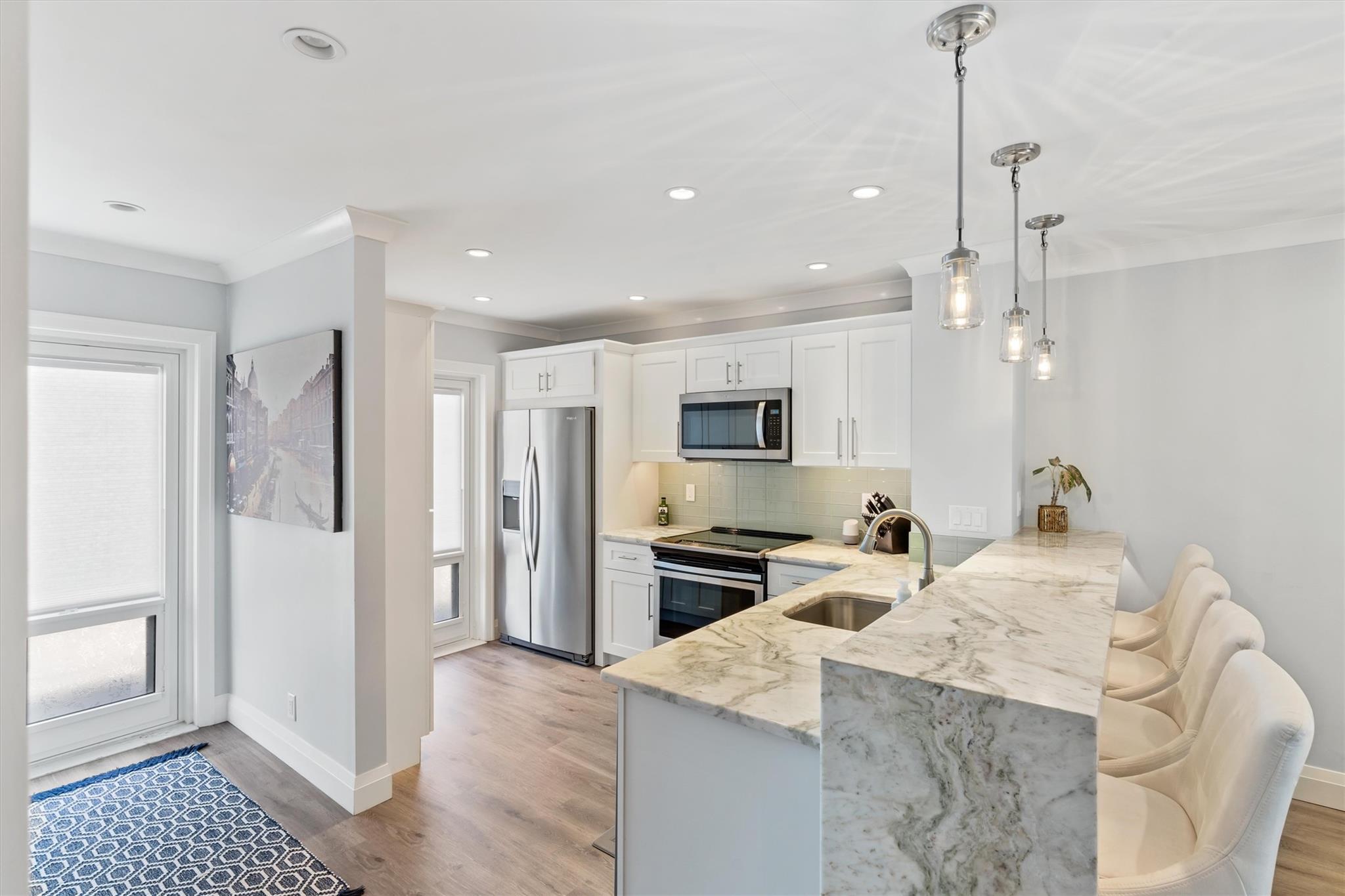 Foyer leading to Fully Renovated Kitchen