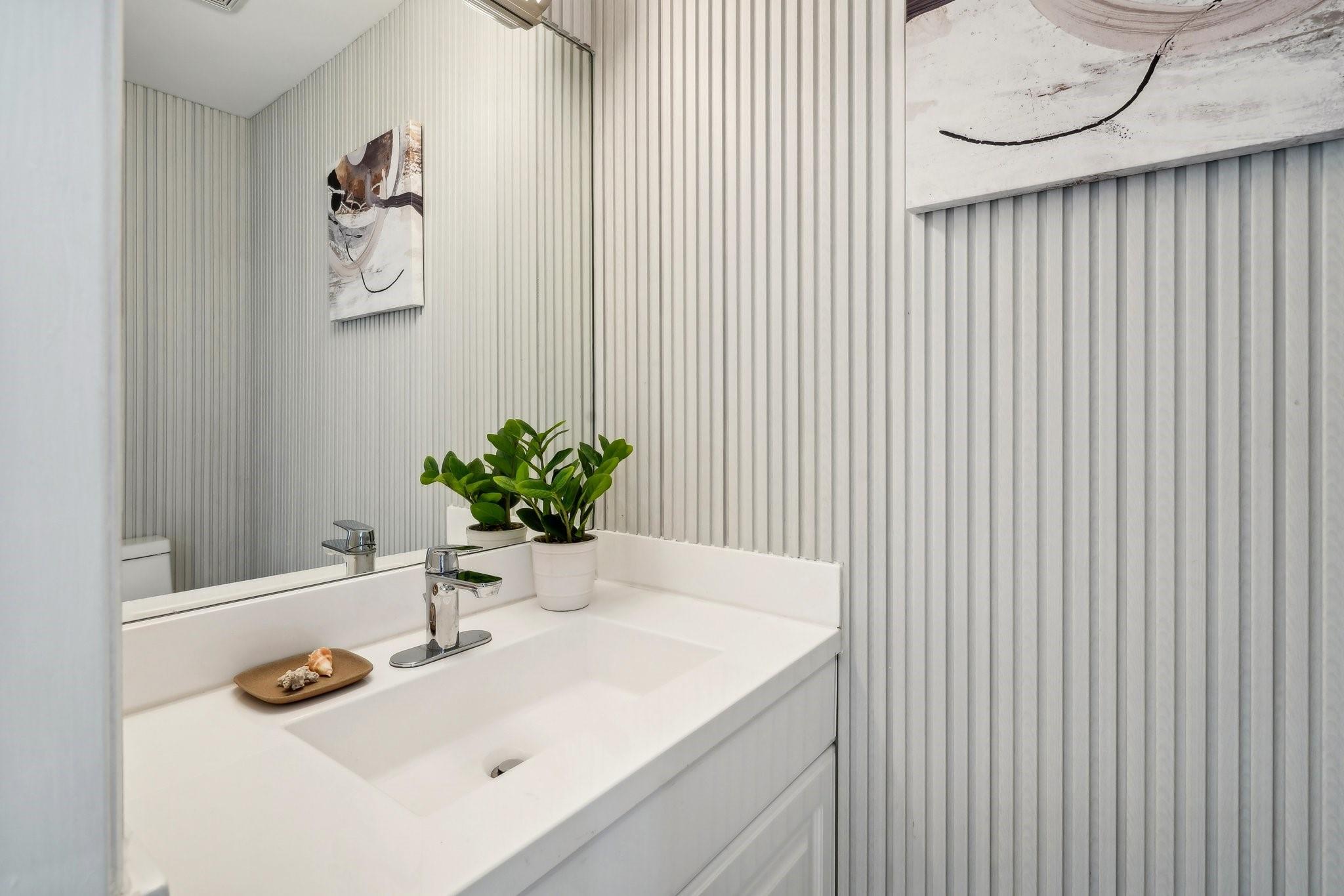 1/2 bath off kitchen with 2 way laundry room