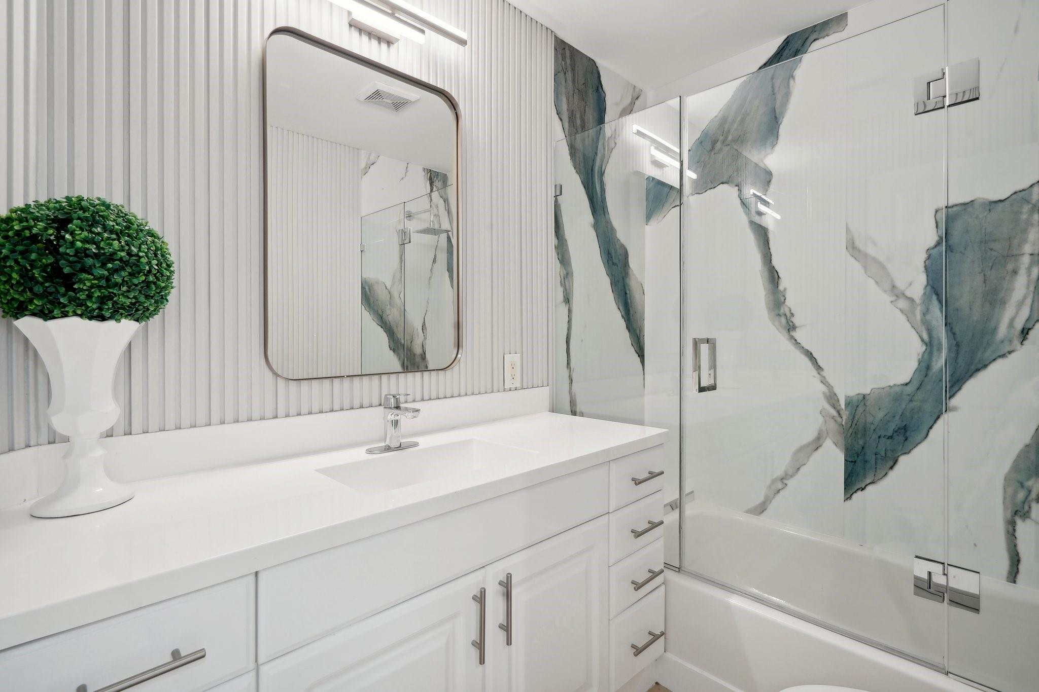 hall bathroom with tub/shower combo main house