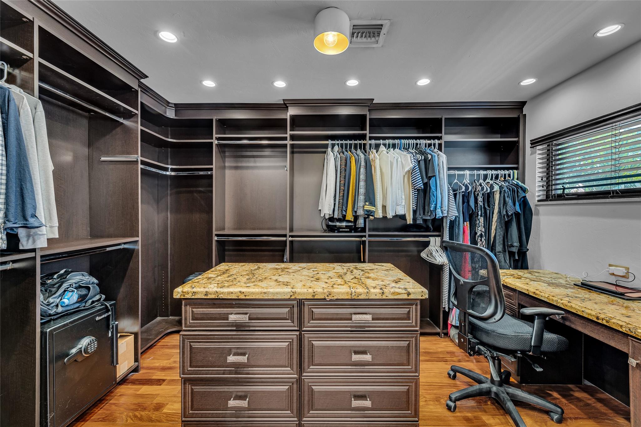 Huge master custom closet with tons of space and could host an office and extra work space