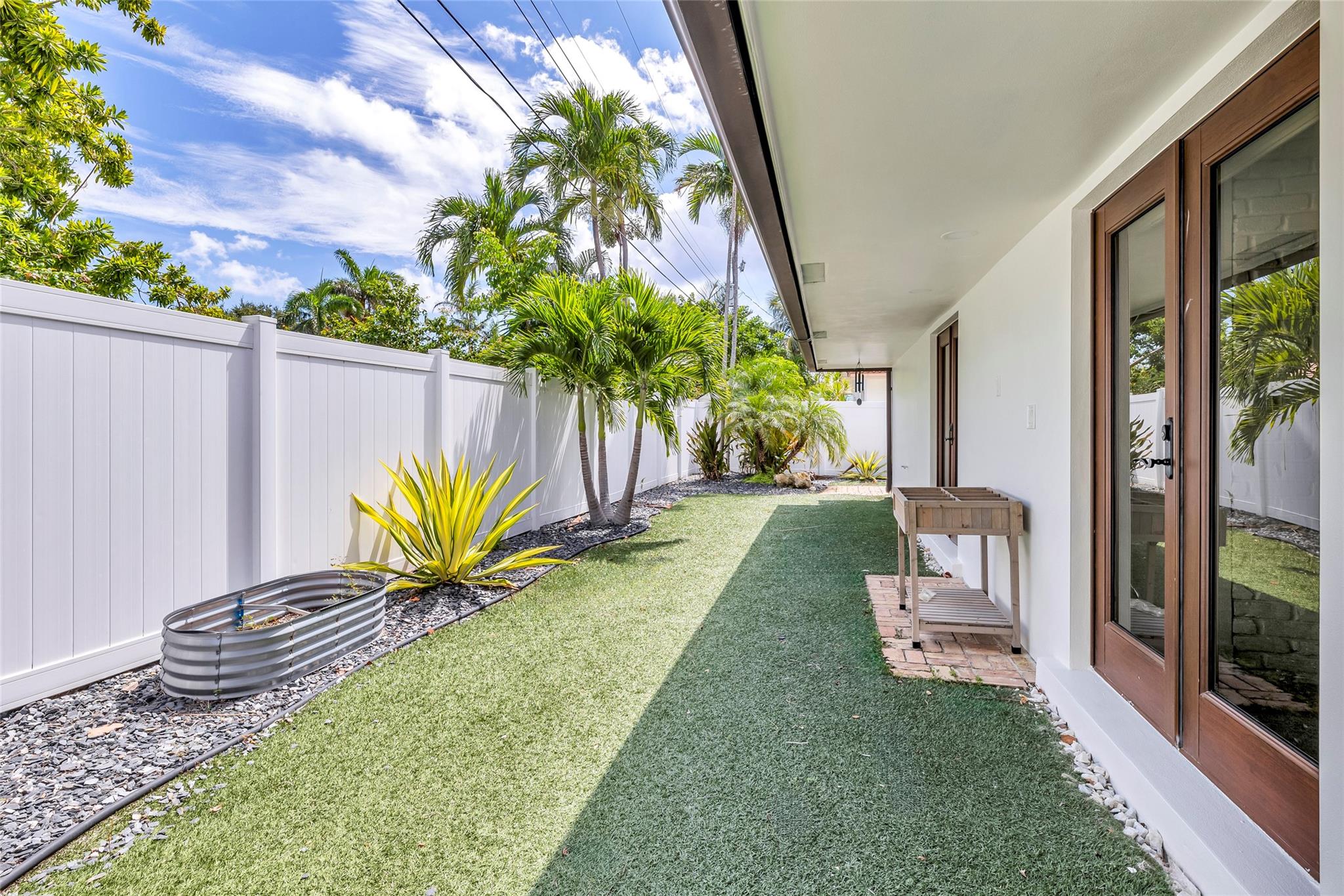 Enjoy creating a garden in this private fenced backyard in Lighthouse Point
