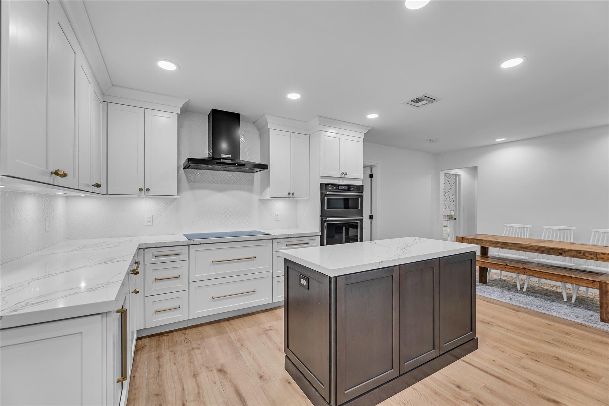 Kitchen is open and spacious with center island that is the perfect space to prep and present meals