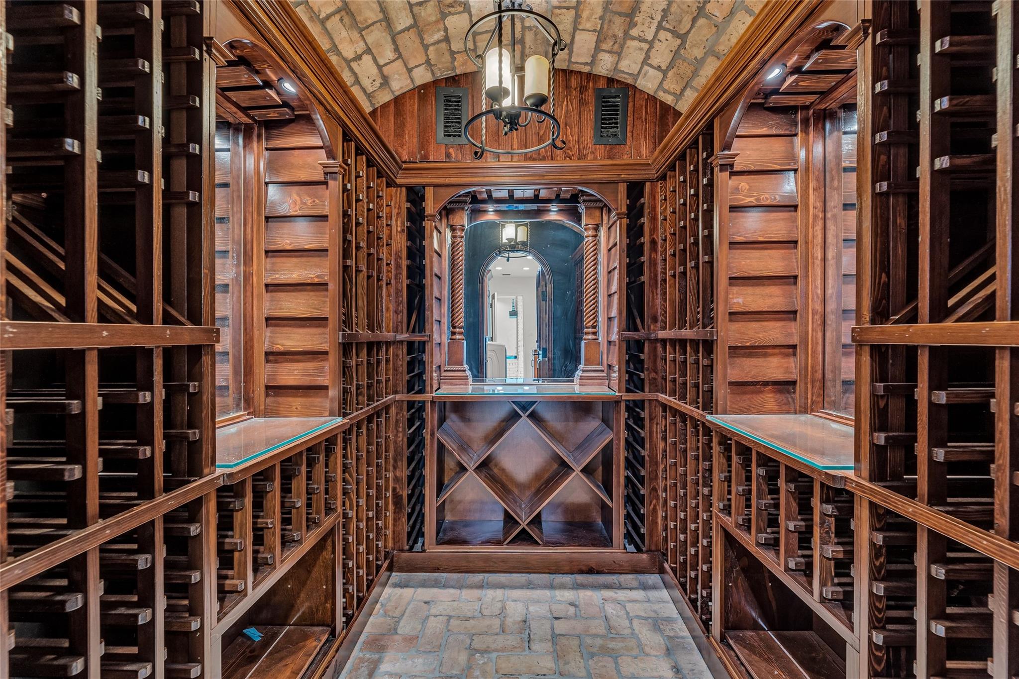 This gorgeous wood and stone wine room is ready to make your wine collection its home.