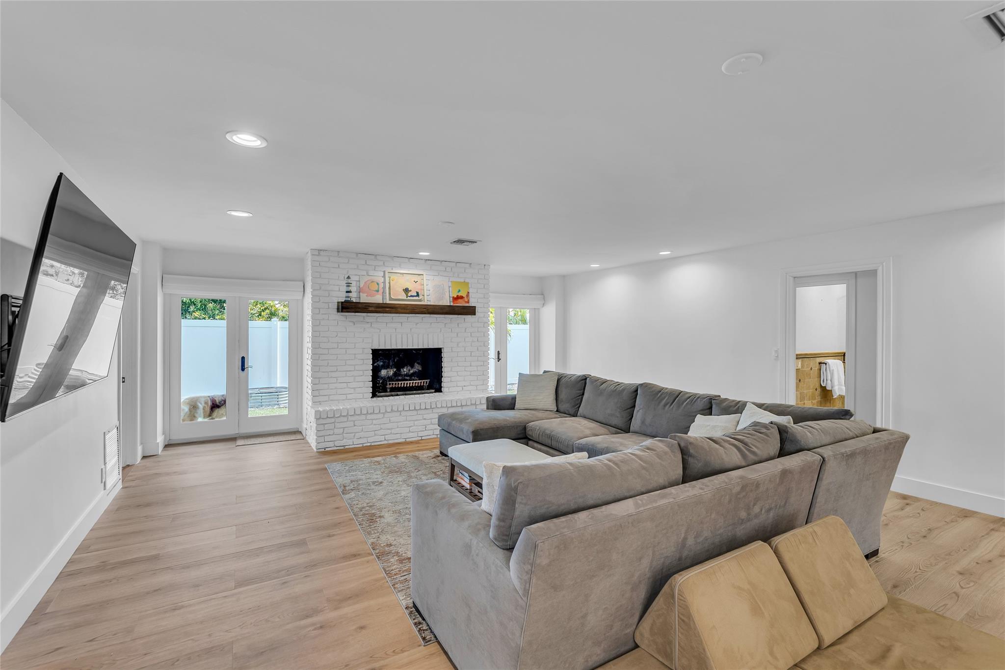 Great natural light and wood burning fireplace offered in spacious family room