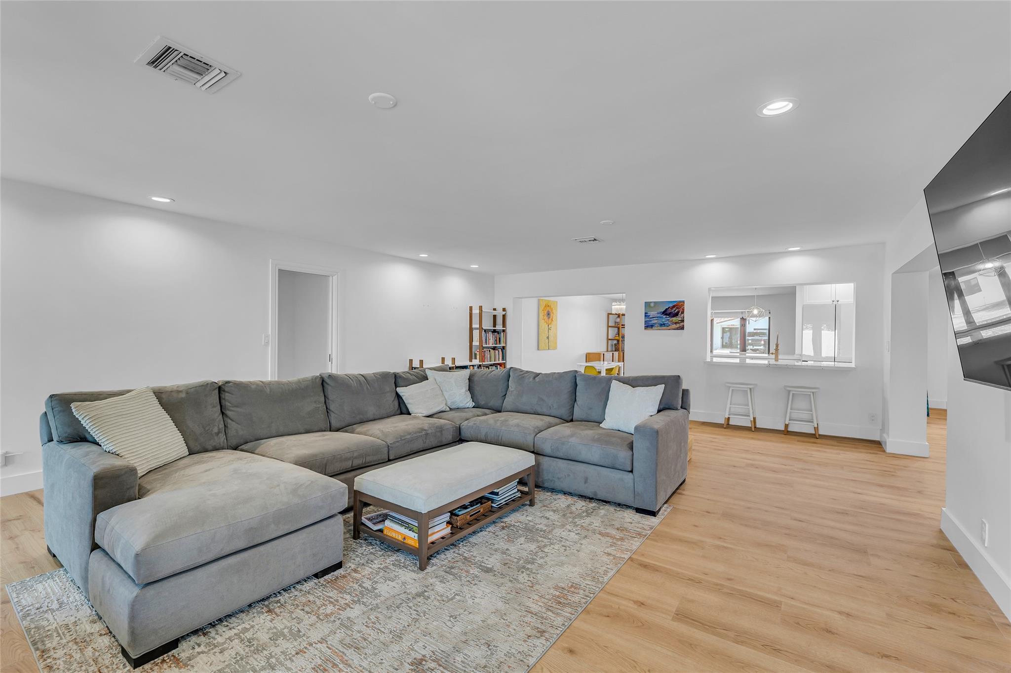 Family room is the perfect space to relax and unwind and has a bar area shared with kitchen