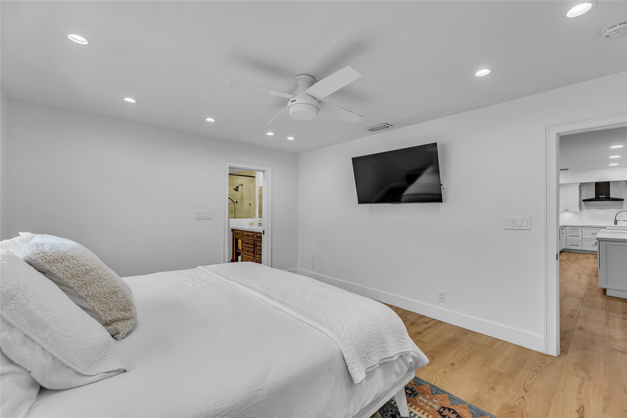 Master Bedroom offers High-hat lighting and overhead ceiling fan with lighting