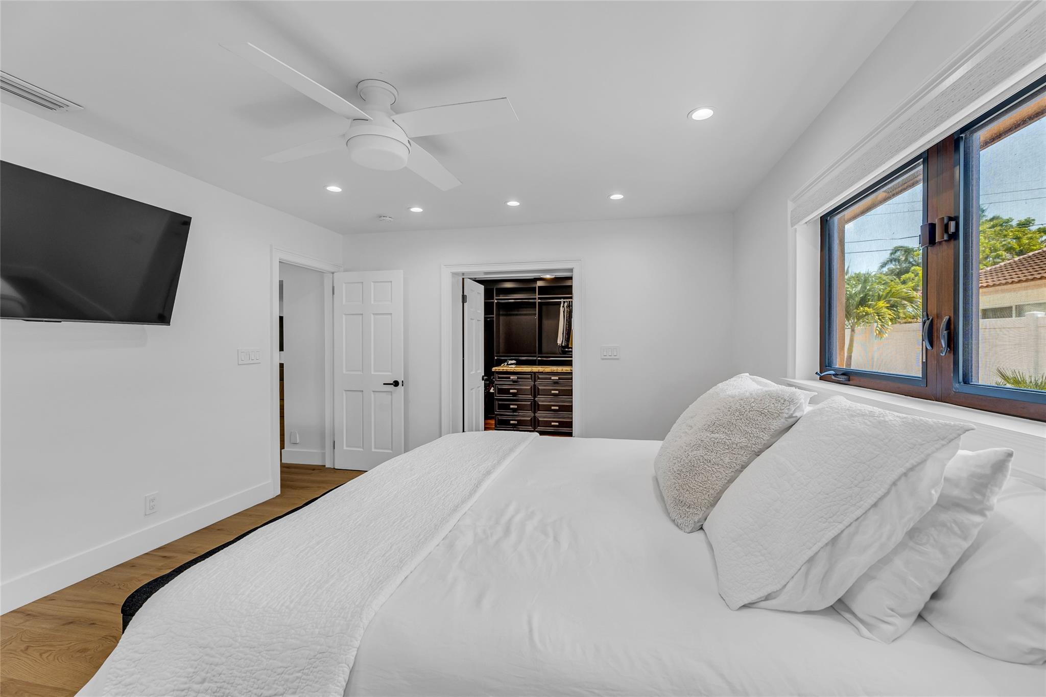 Master bedroom with large walk in custom closet