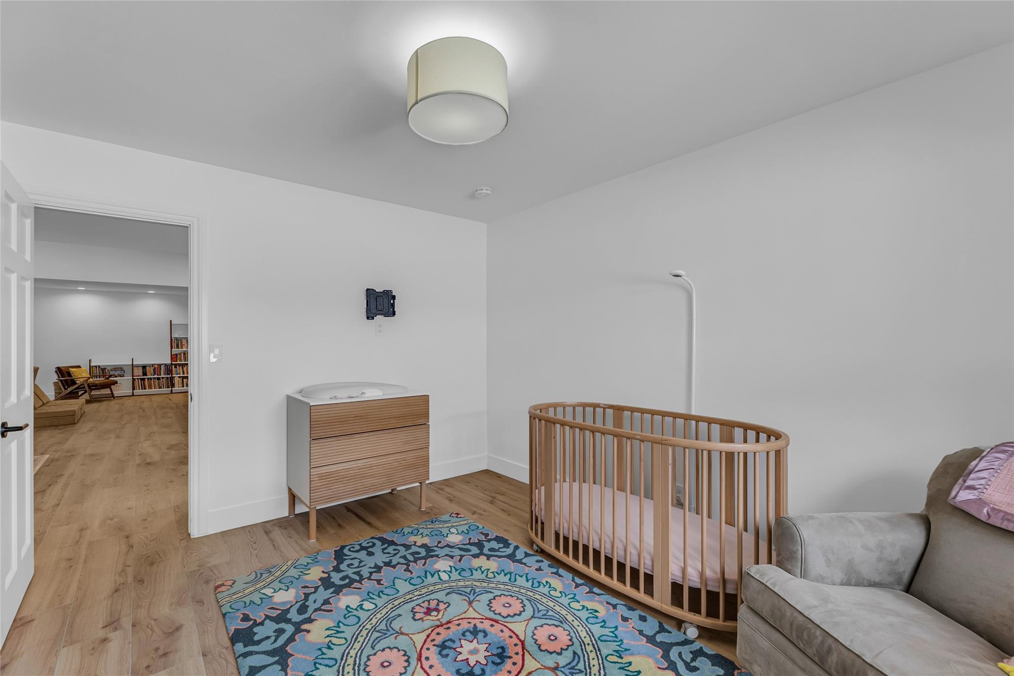 Second bedroom with wood plank tile flooring
