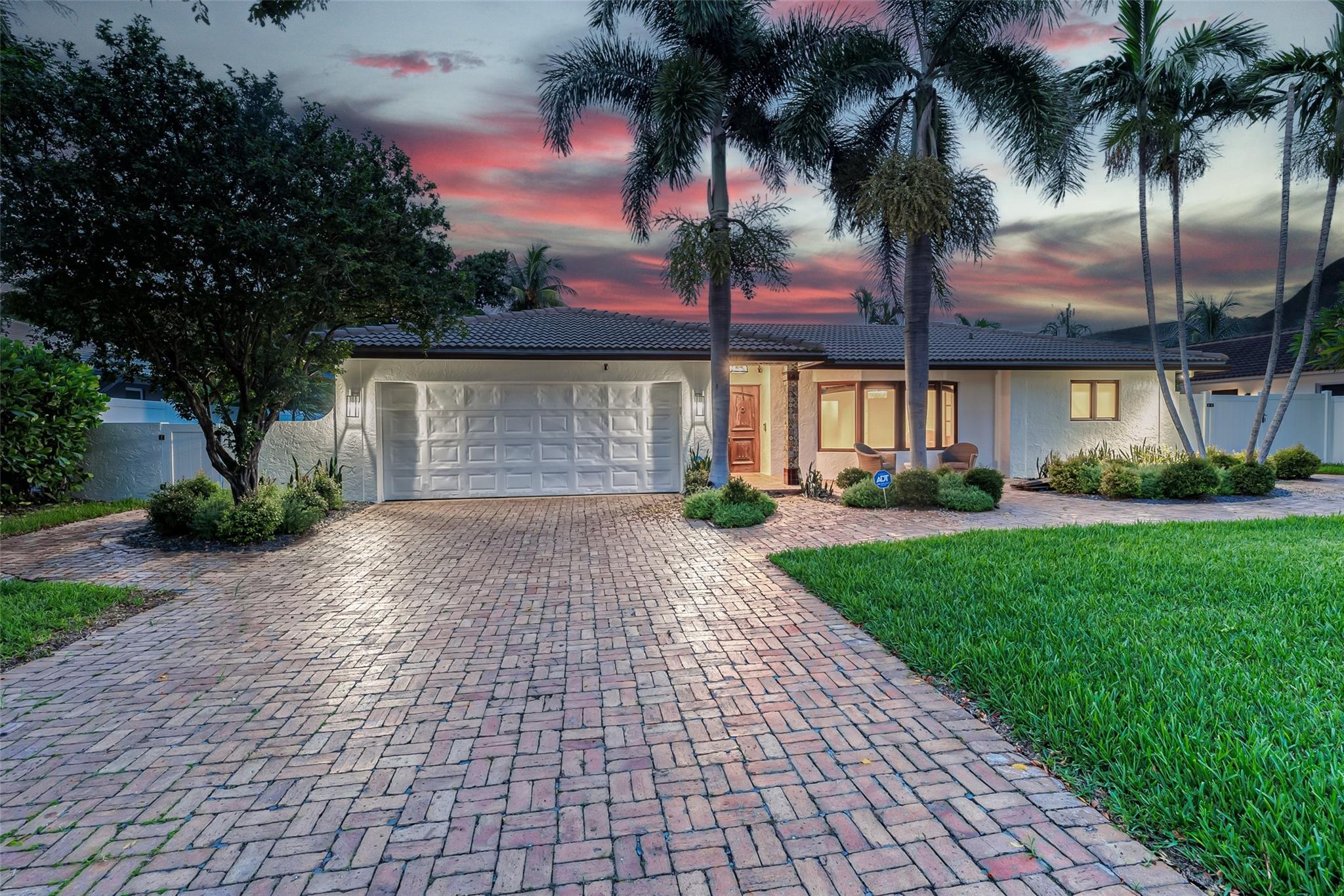 Large driveway and 2 car garage offer great parking