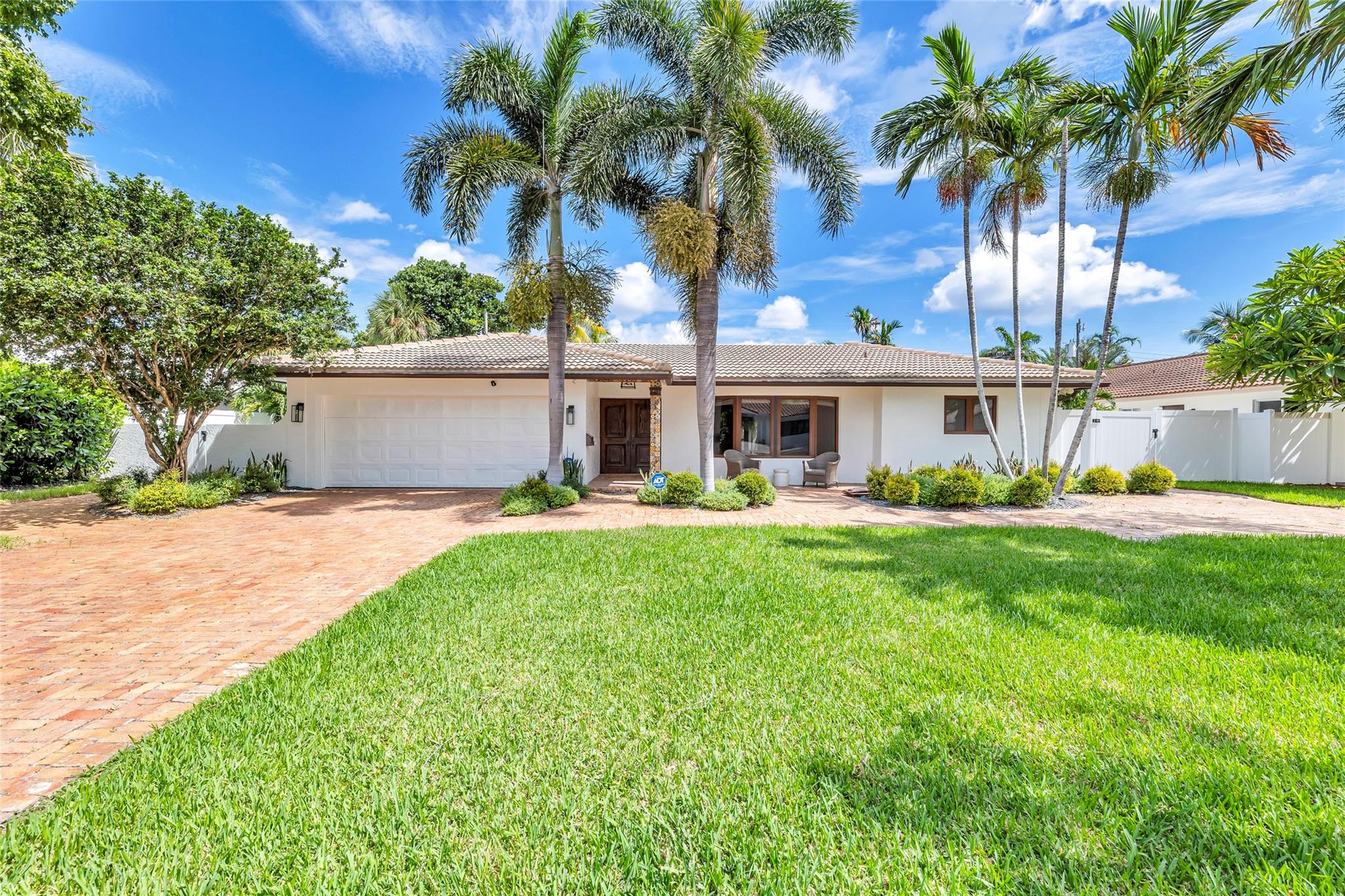 Large pavered driveway and 2 car garage provides an abundance of parking for your friends and family