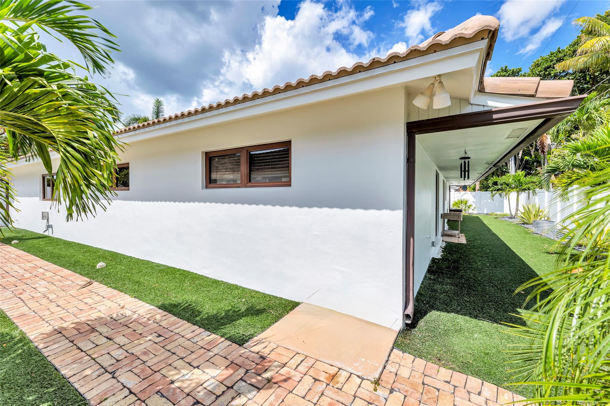 Chicago brick pathways and turf backyard offers a clean and meticulous exterior of home