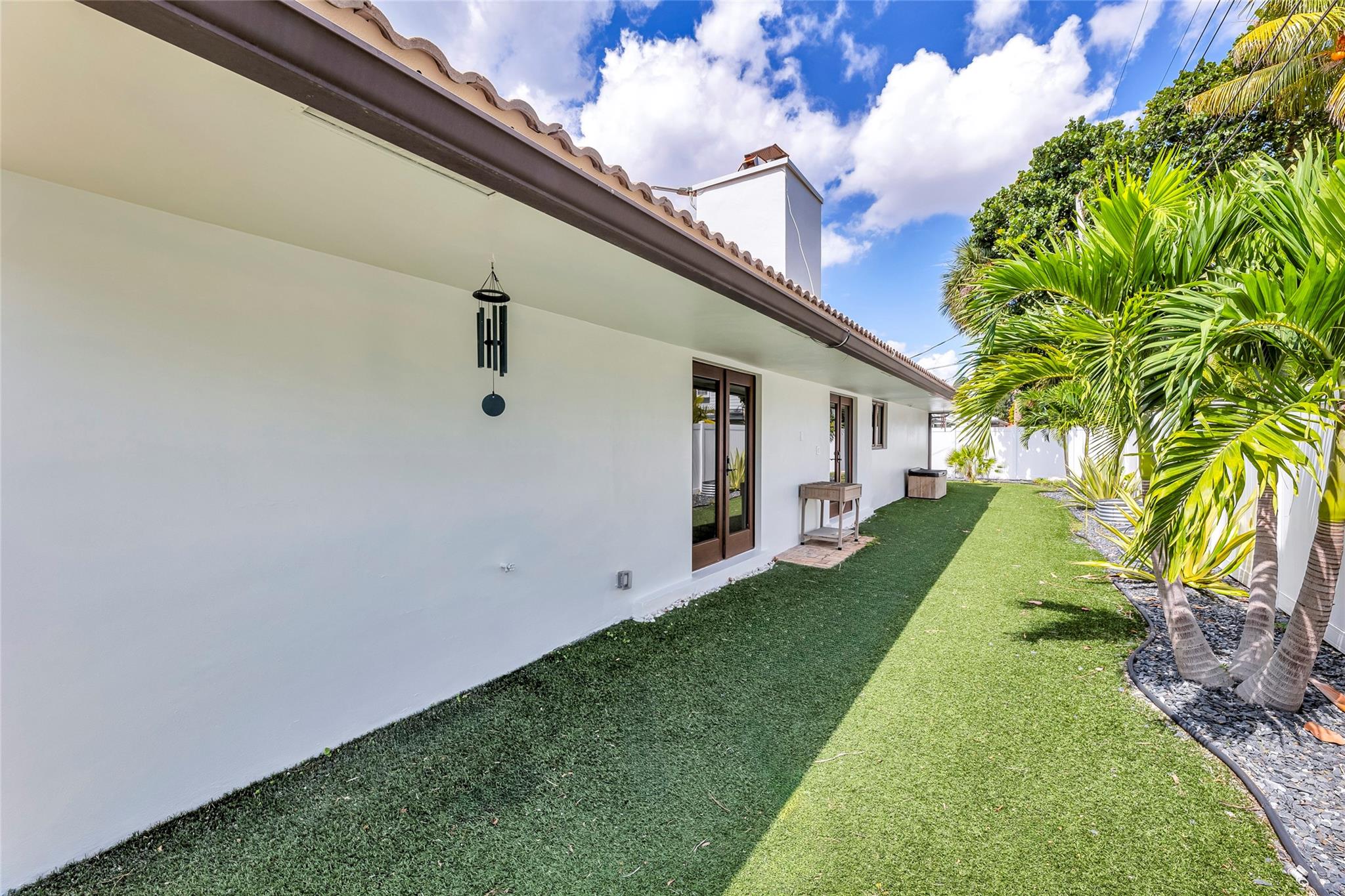 Backyard with French doors in and out of home