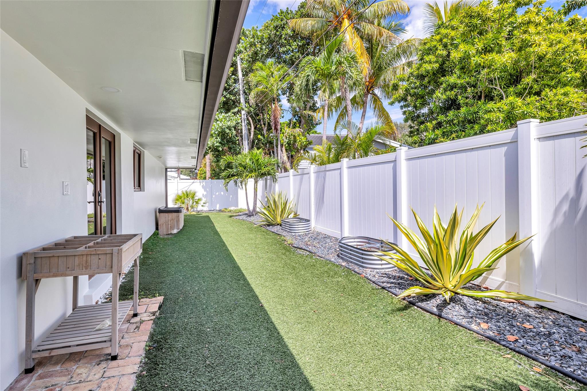 Fully fenced backyard offers a private retreat with great landscaping and gardening opportunities
