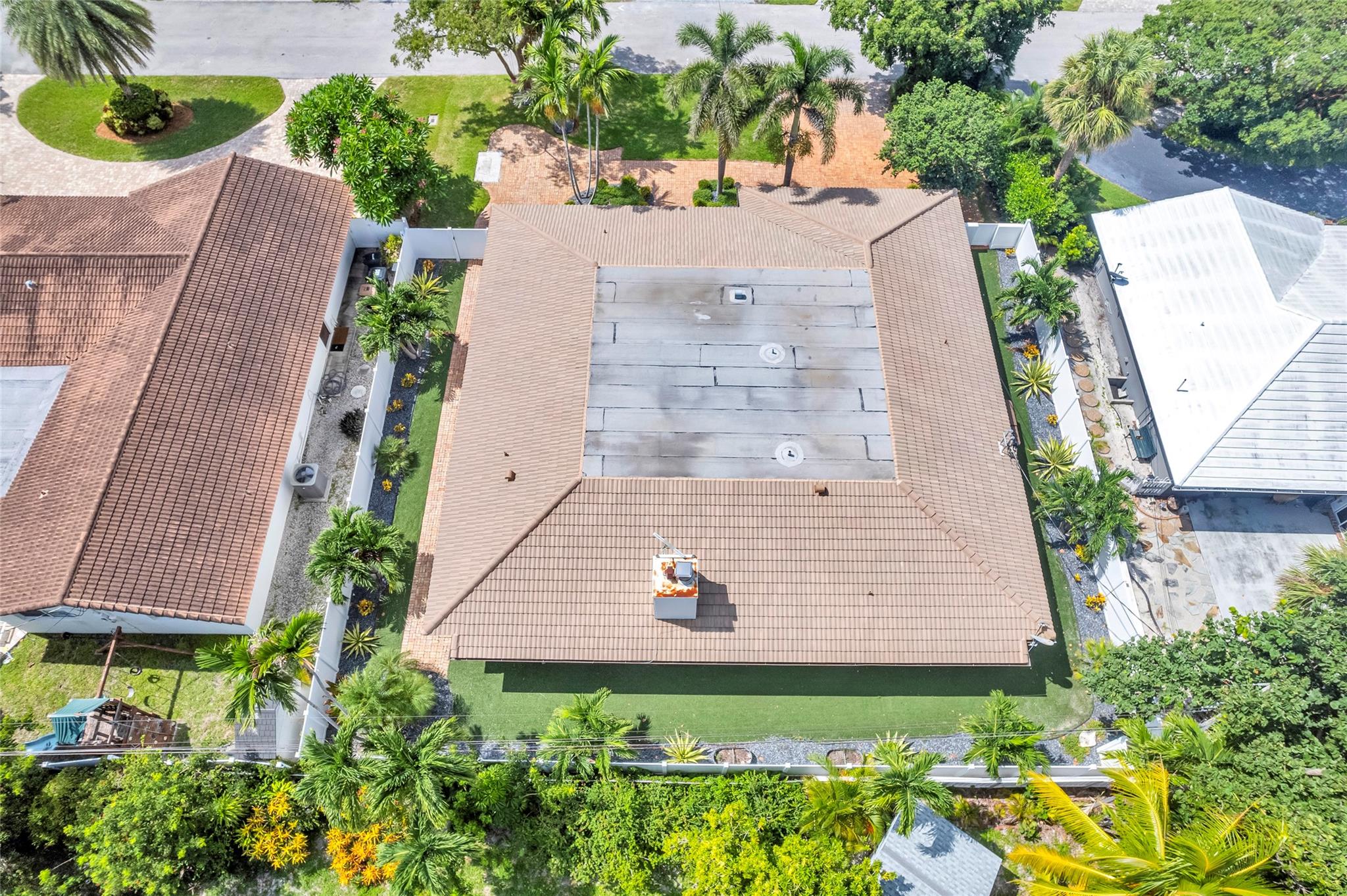 Turfed backyard is privately fenced and located in Venetian Isles close to Lighthouse Points yacht club
