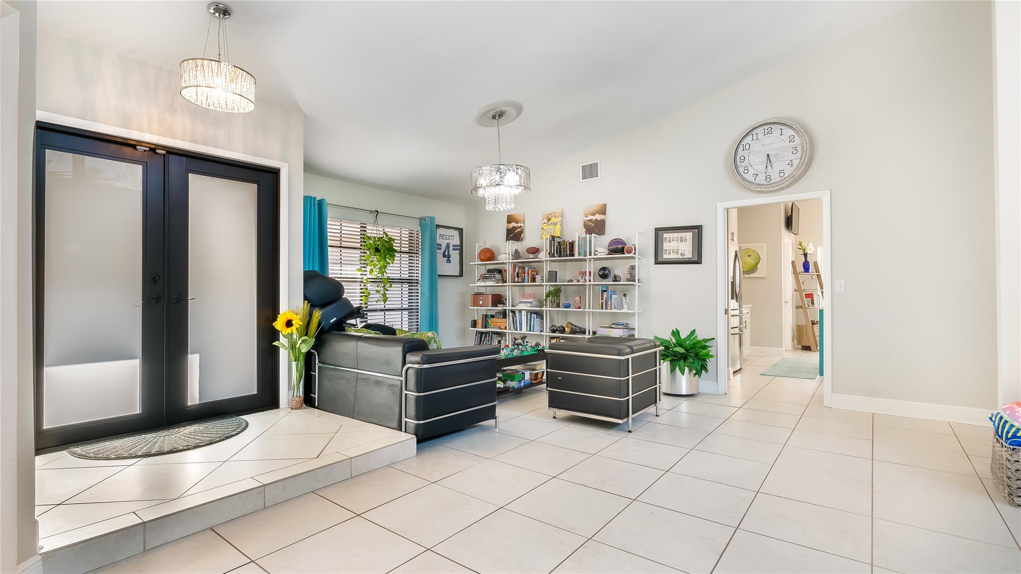 Step into the epitome of modern elegance with this open-concept living room, a central feature of the home.