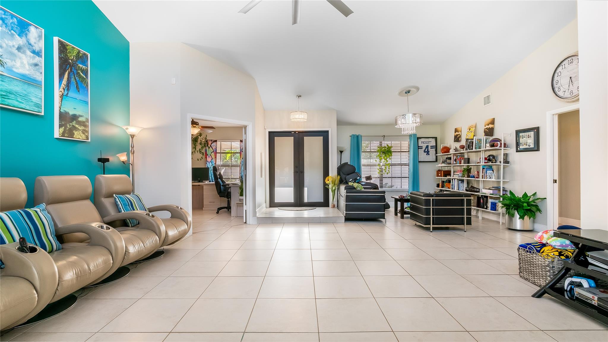 High vaulted ceilings enhance the sense of openness, while the natural light streaming through adds warmth and vitality.