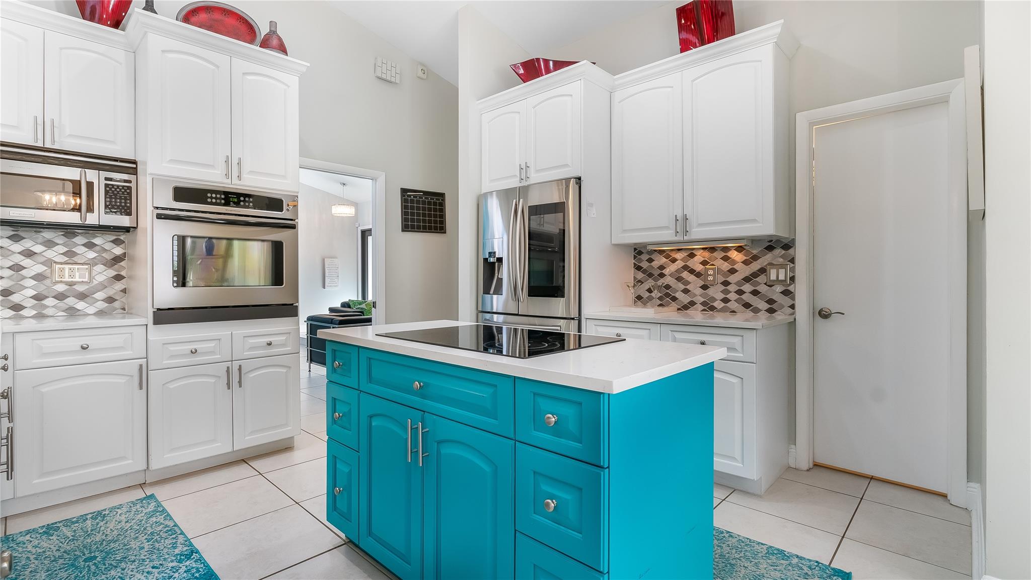 Enjoy cooking on the chef's island range and wall mounted oven and microwave. Or play some tunes from the Samsung Smart Refrigerator.