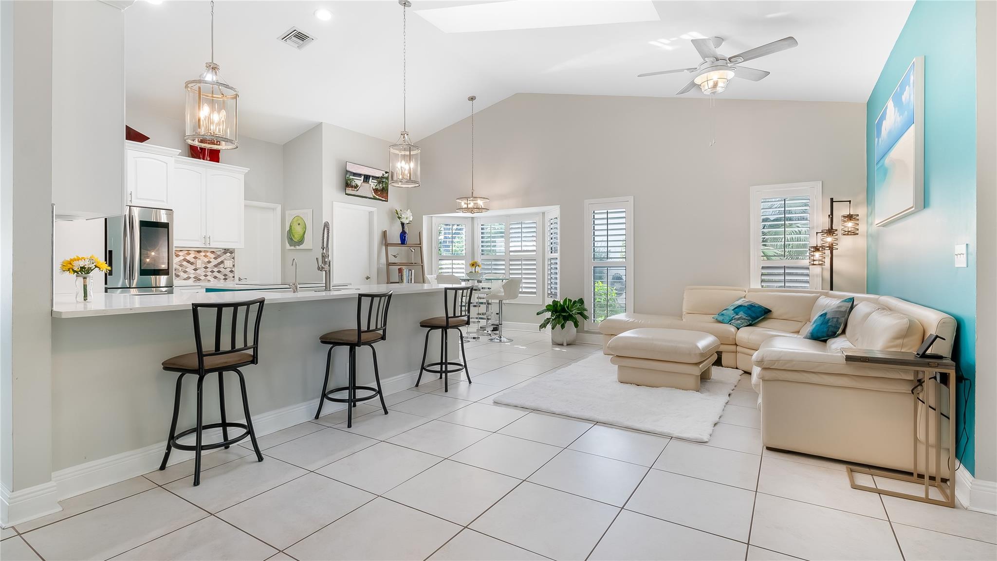 Dreamy Open Layout 
to make memories in this sunlit open-concept space where the family room seamlessly flows into sleek modern kitchen and elegant dining area, or walkout to the covered patio and enjoy life of luxury by the pool!