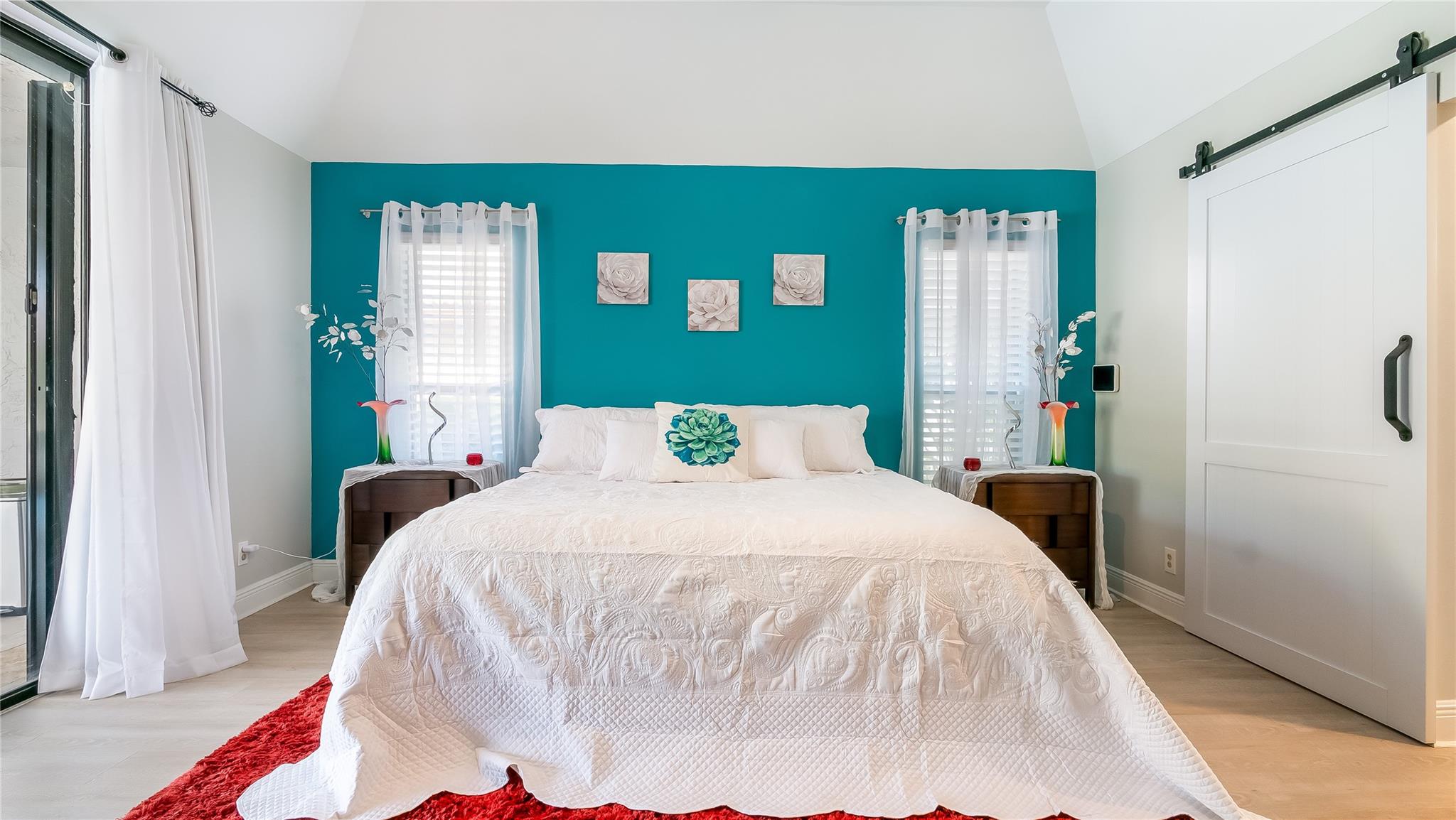 Step into the sumptuous master bedroom retreat where modern farmhouse style seamlessly blends comfort and luxury. Bright and airy, this generously sized sanctuary is awash in warm natural light .