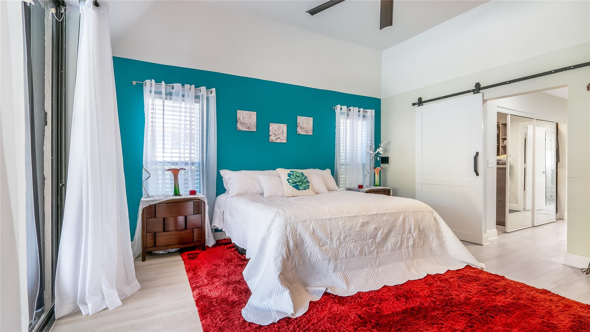 A star in the space is the authentic barn door leading to the exceptional master closet and spa-like bathroom suite.