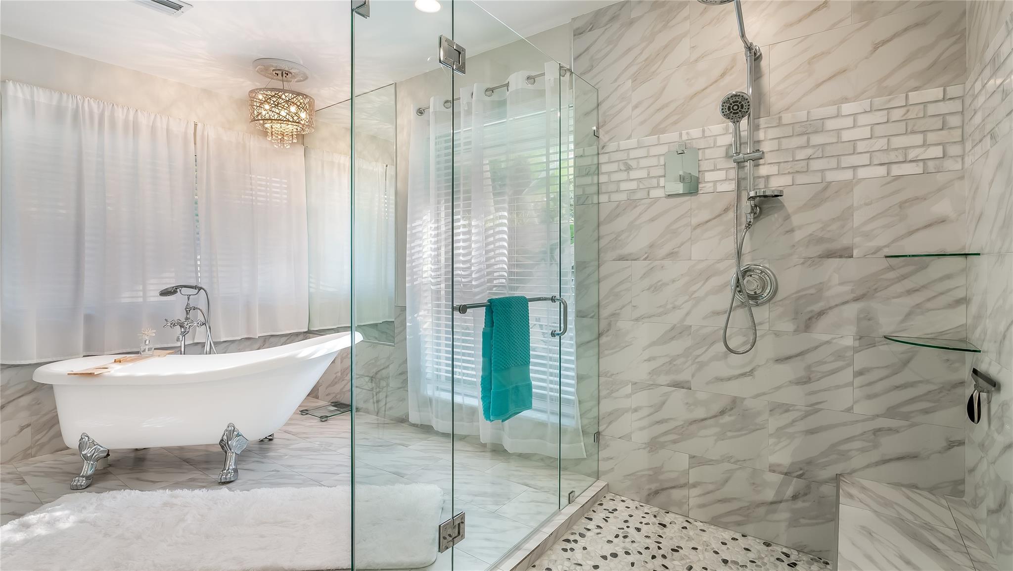  Soak away stress in the freestanding soaker tub positioned by a private view window.