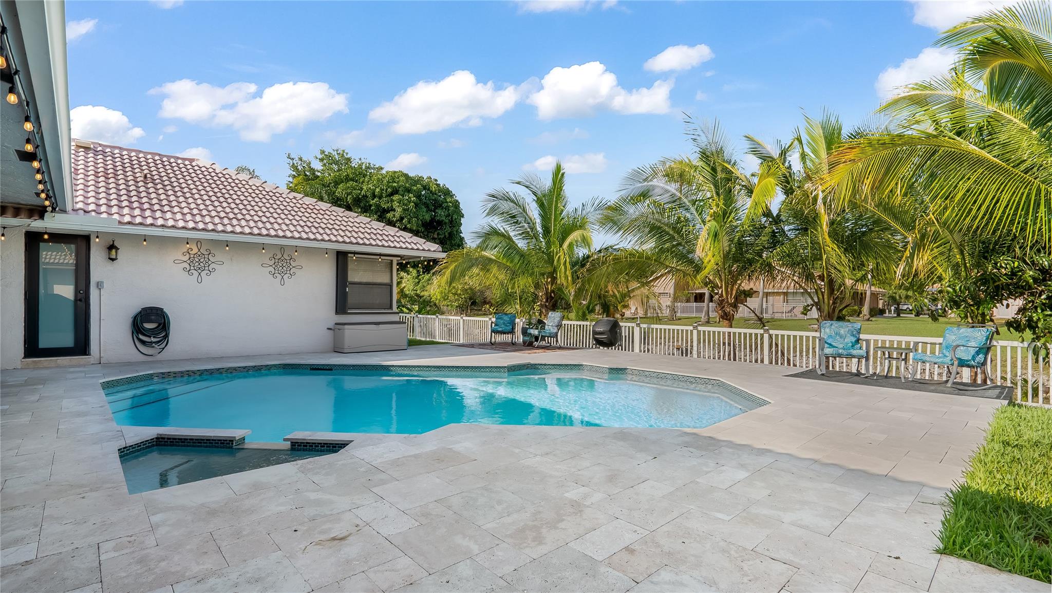 Lush landscaping envelops the space in verdant beauty without compromising the stunning views.