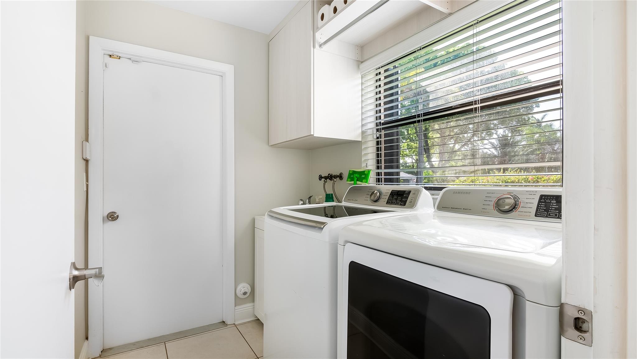 The laundry room is a model of efficiency, with ample storage and an intuitive layout that streamlines your household chores.