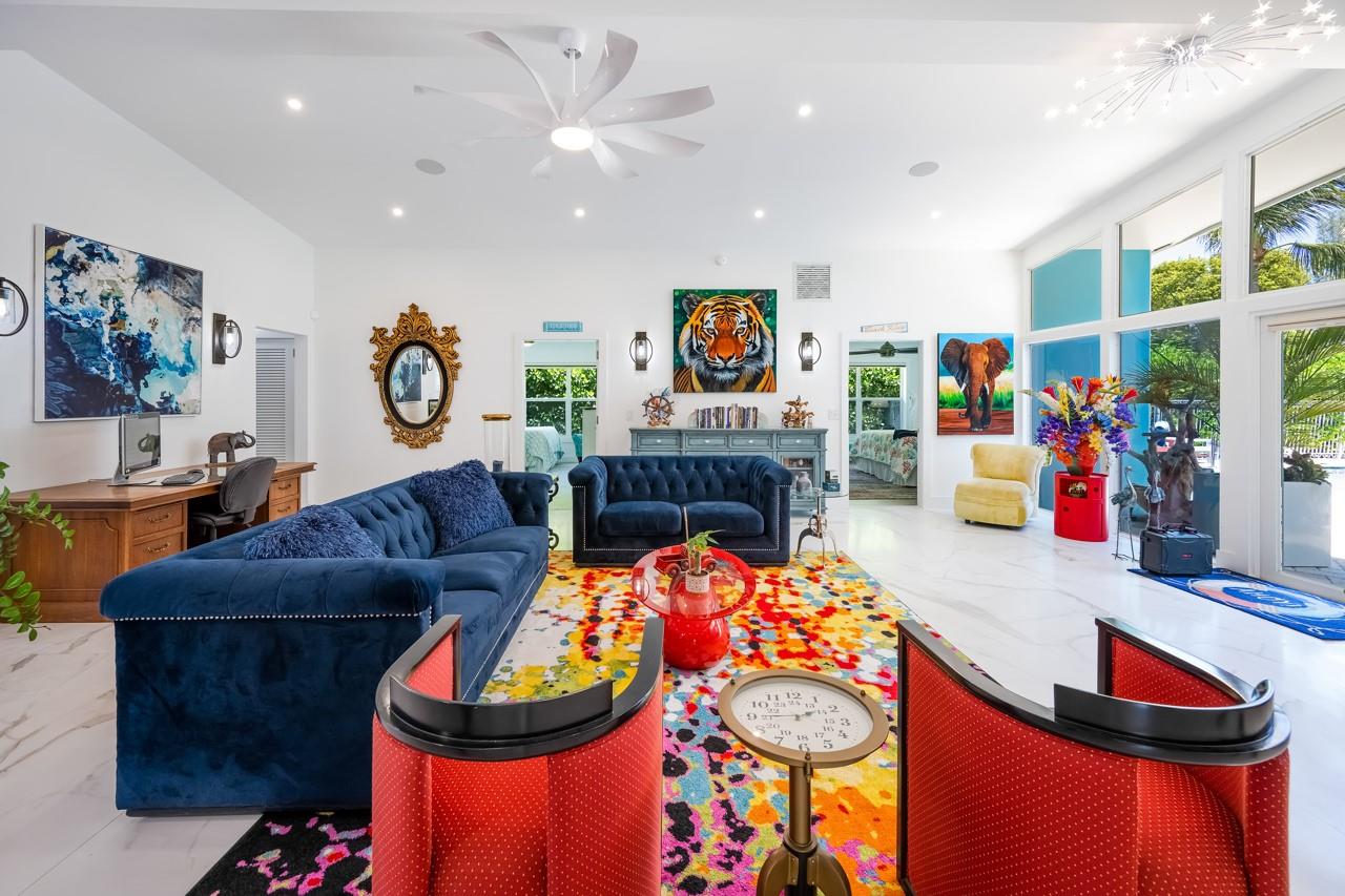 Add a Colorful Rug and this Room POPS! Wall of Windows Front and Back