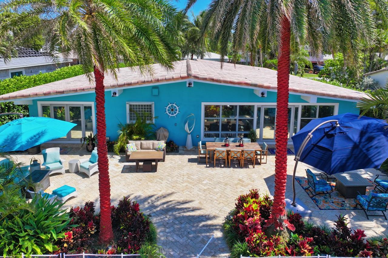 80 Foot of waterfront Travertine Patio w/ gorgeous Palms and Landscaping