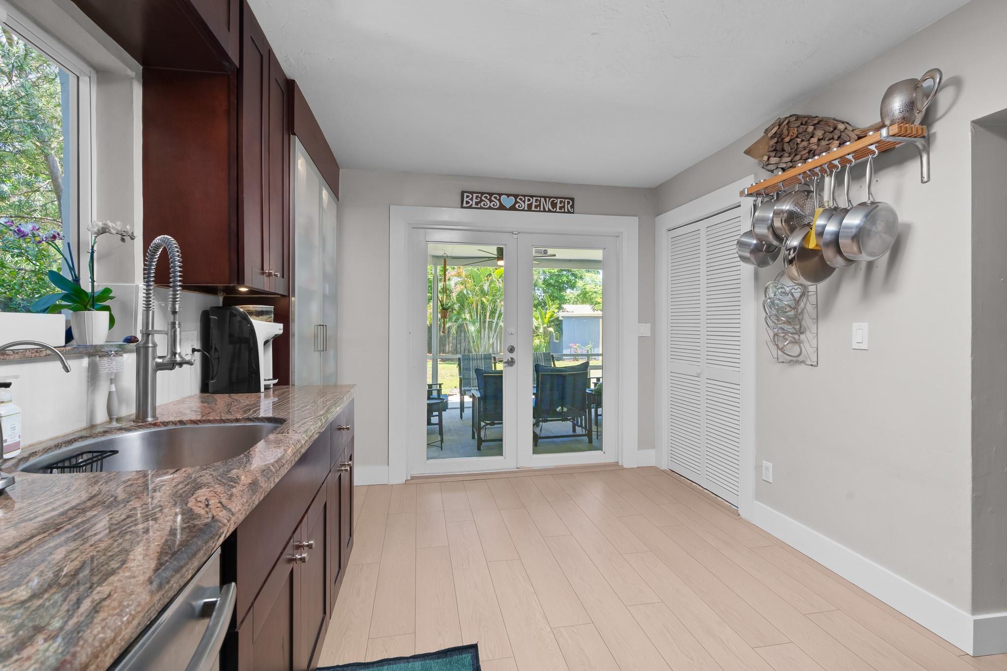 These impact doors will lead you out to the expansive, screened porch.