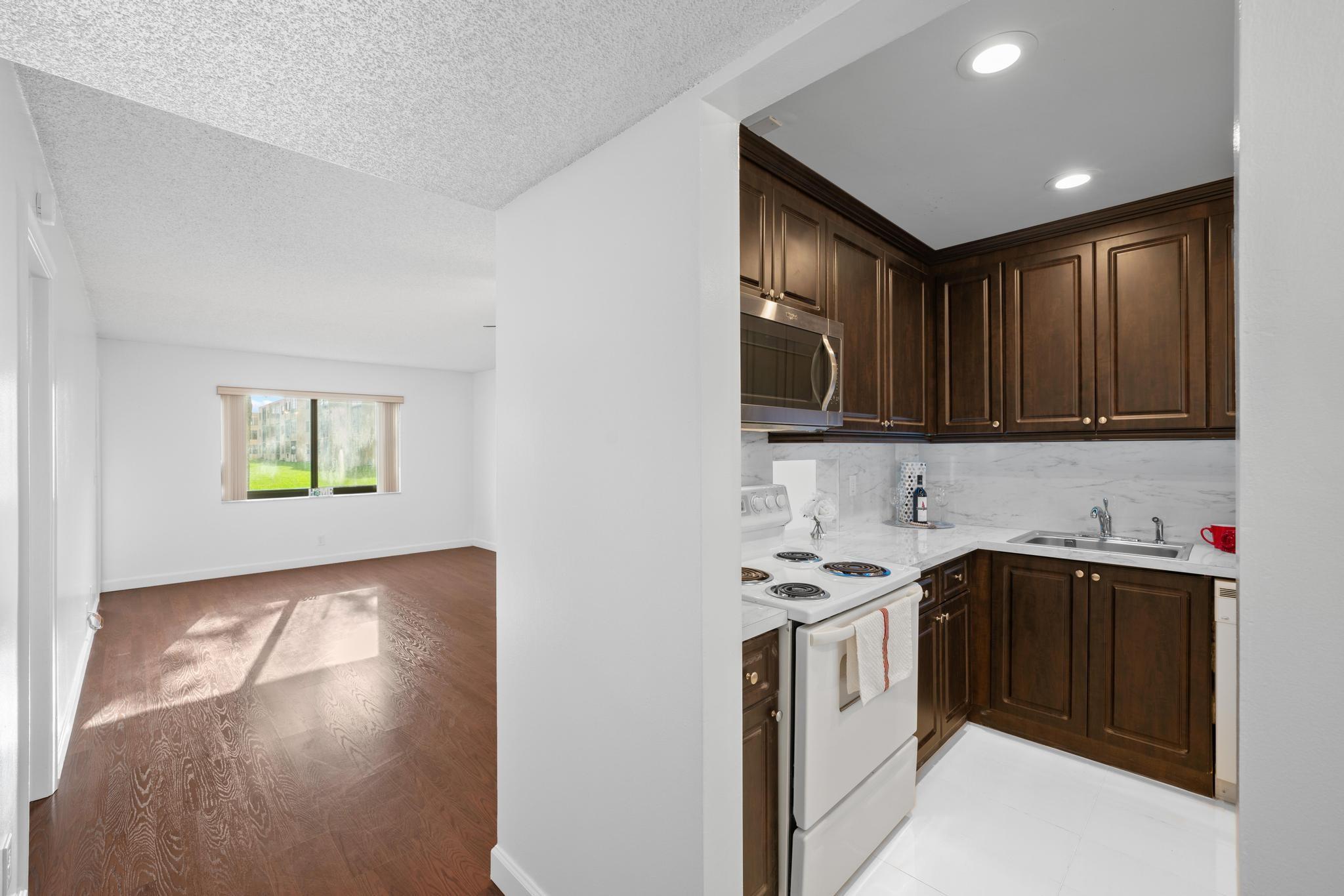 White polished porcelain flooring in kitchen.