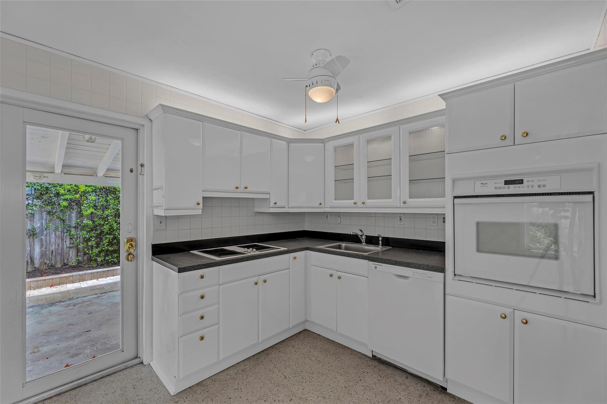 Kitchen with view to large carport