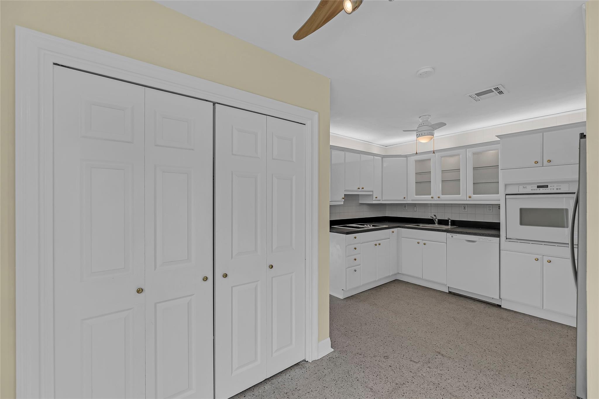 With full laundry in foreground behind the doors