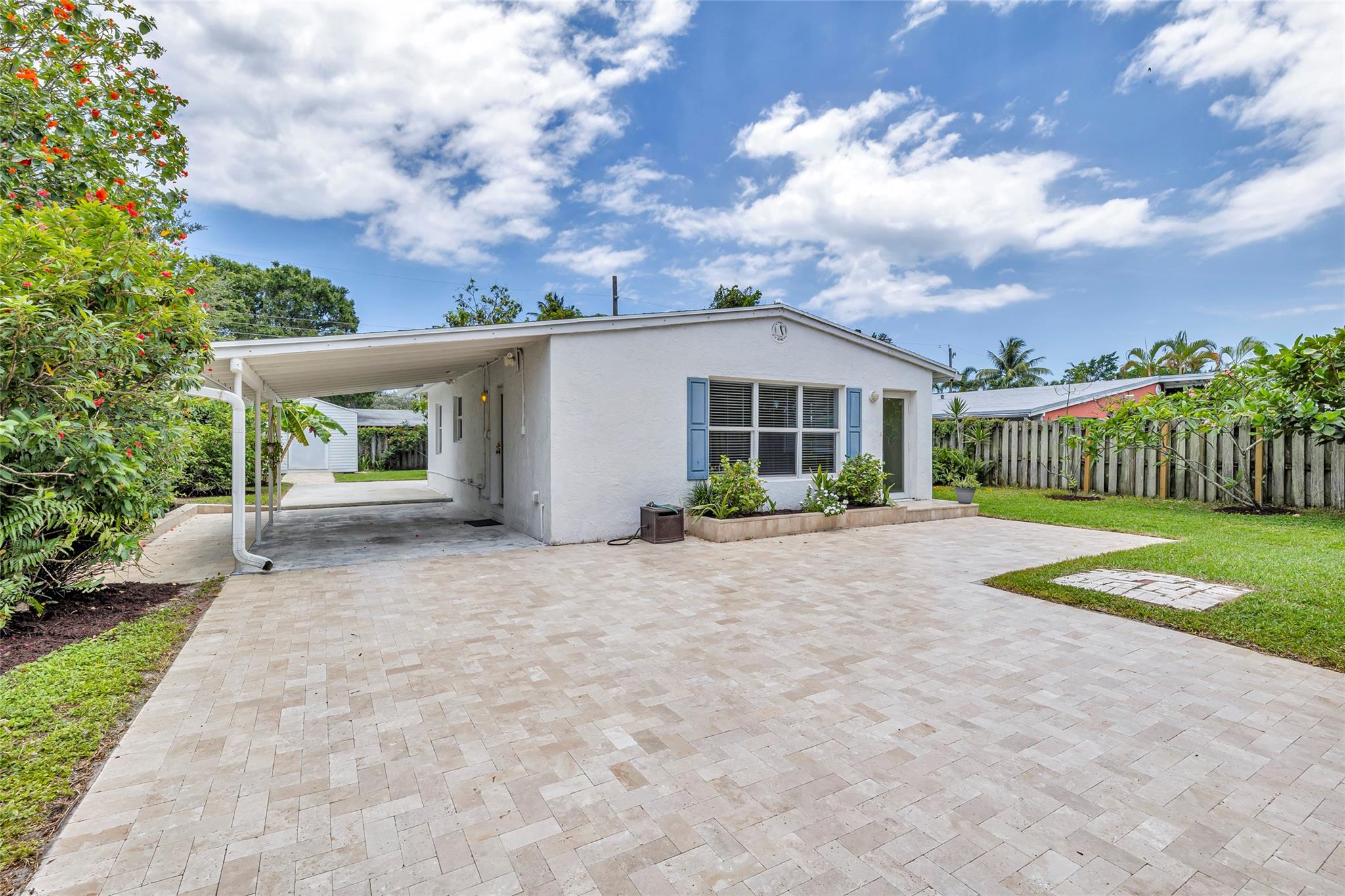 With large patio, driveway and carport.  Room for your toys!