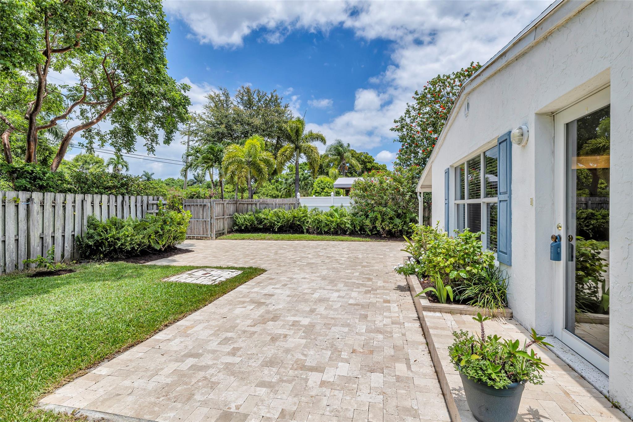 Large travertine patio and yard