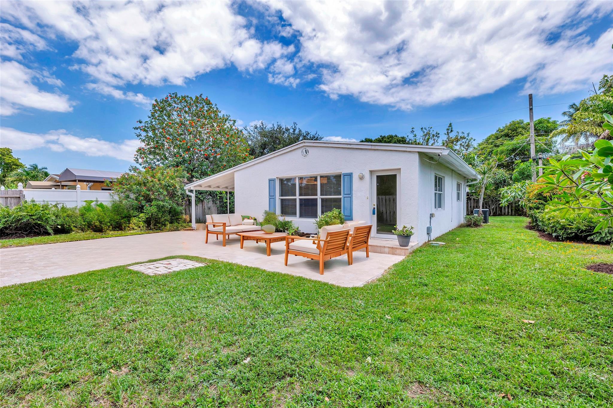 Large front yard and virtually staged travertine patio