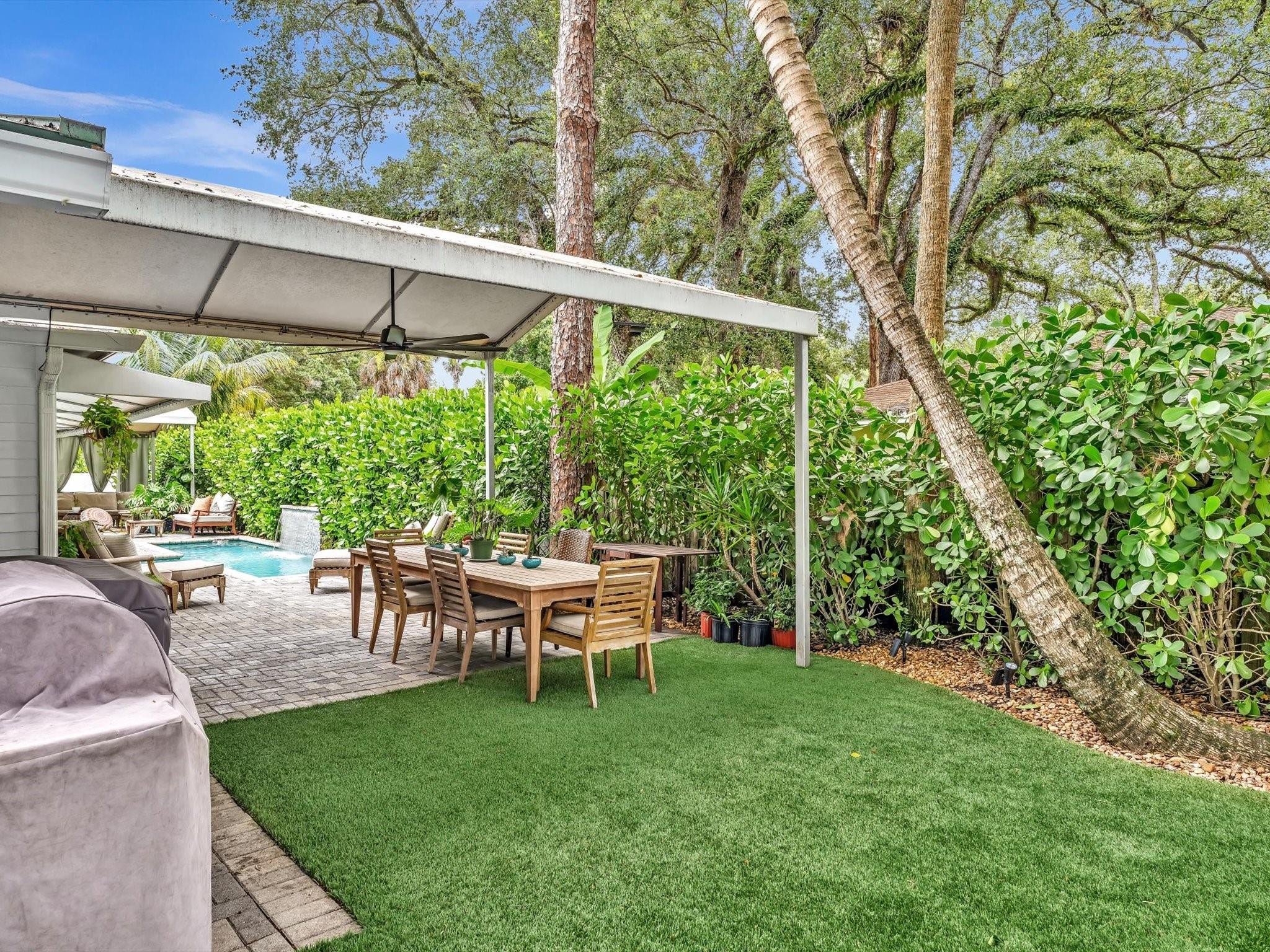 Large outdoor dining area and astro turf