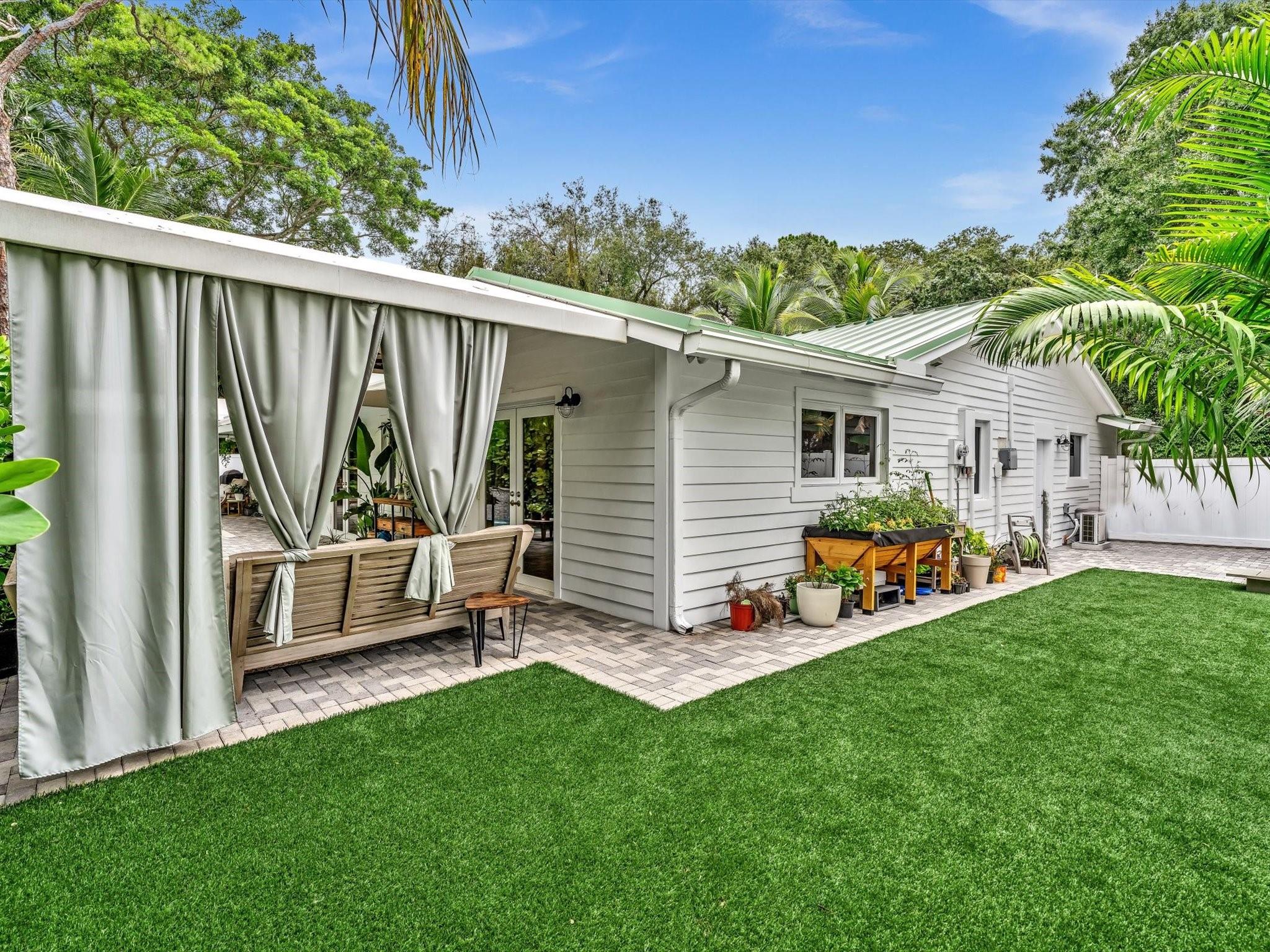 Serene seating areas throughout secluded yard.
