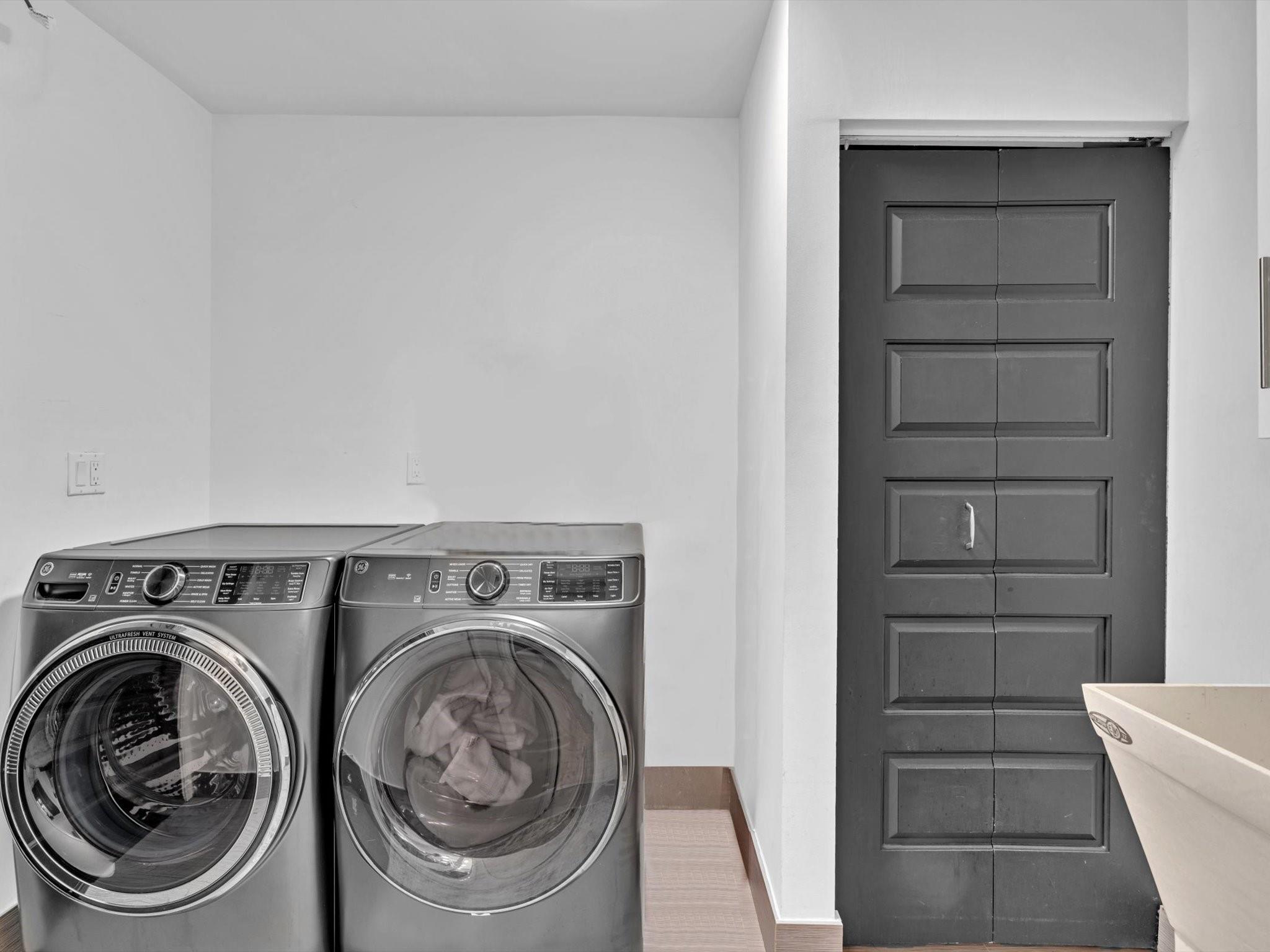 New Front loading Washer and Dryer and Sink in Laundry room