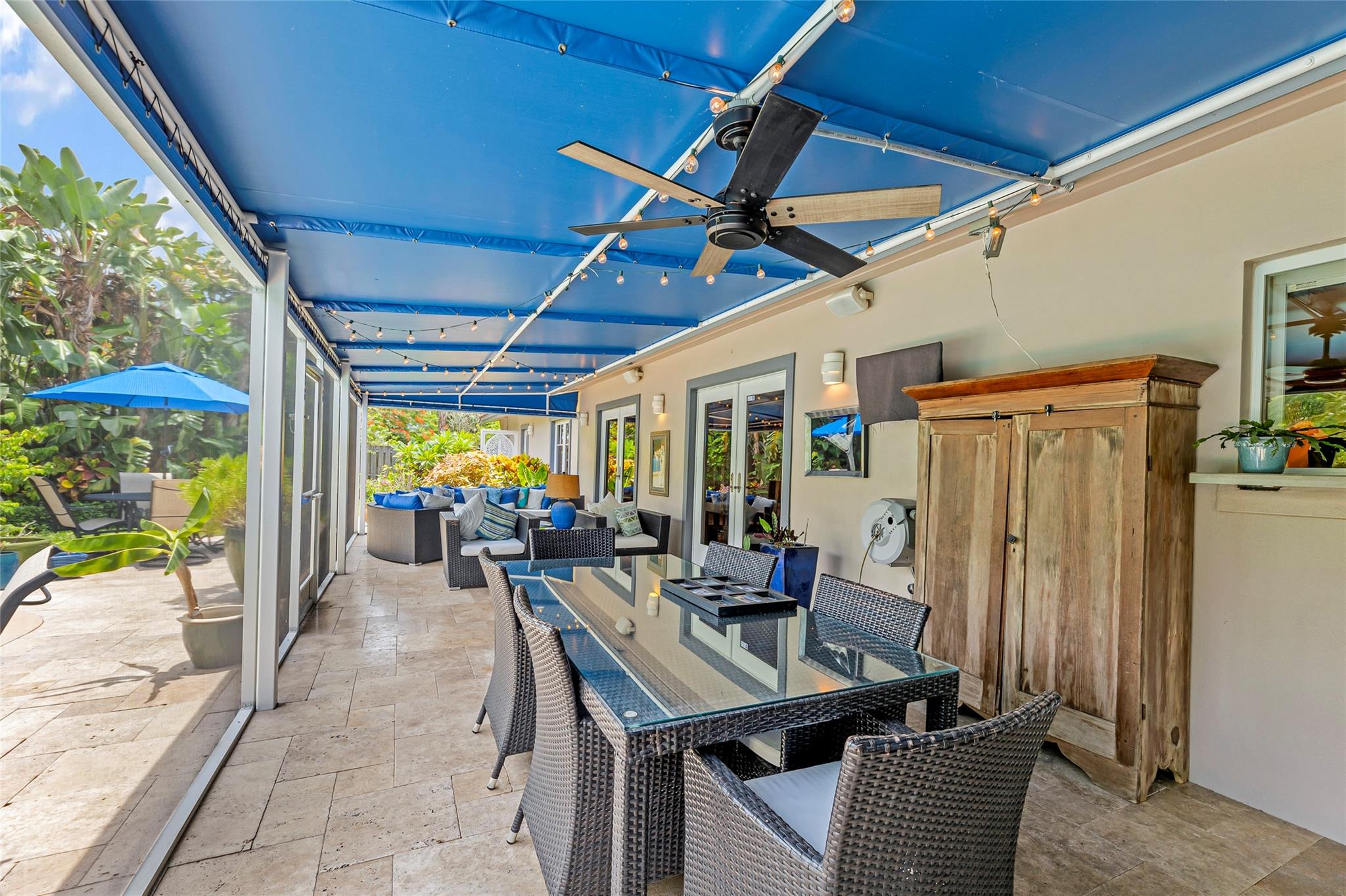 Outdoor Dining and Living in screened room.