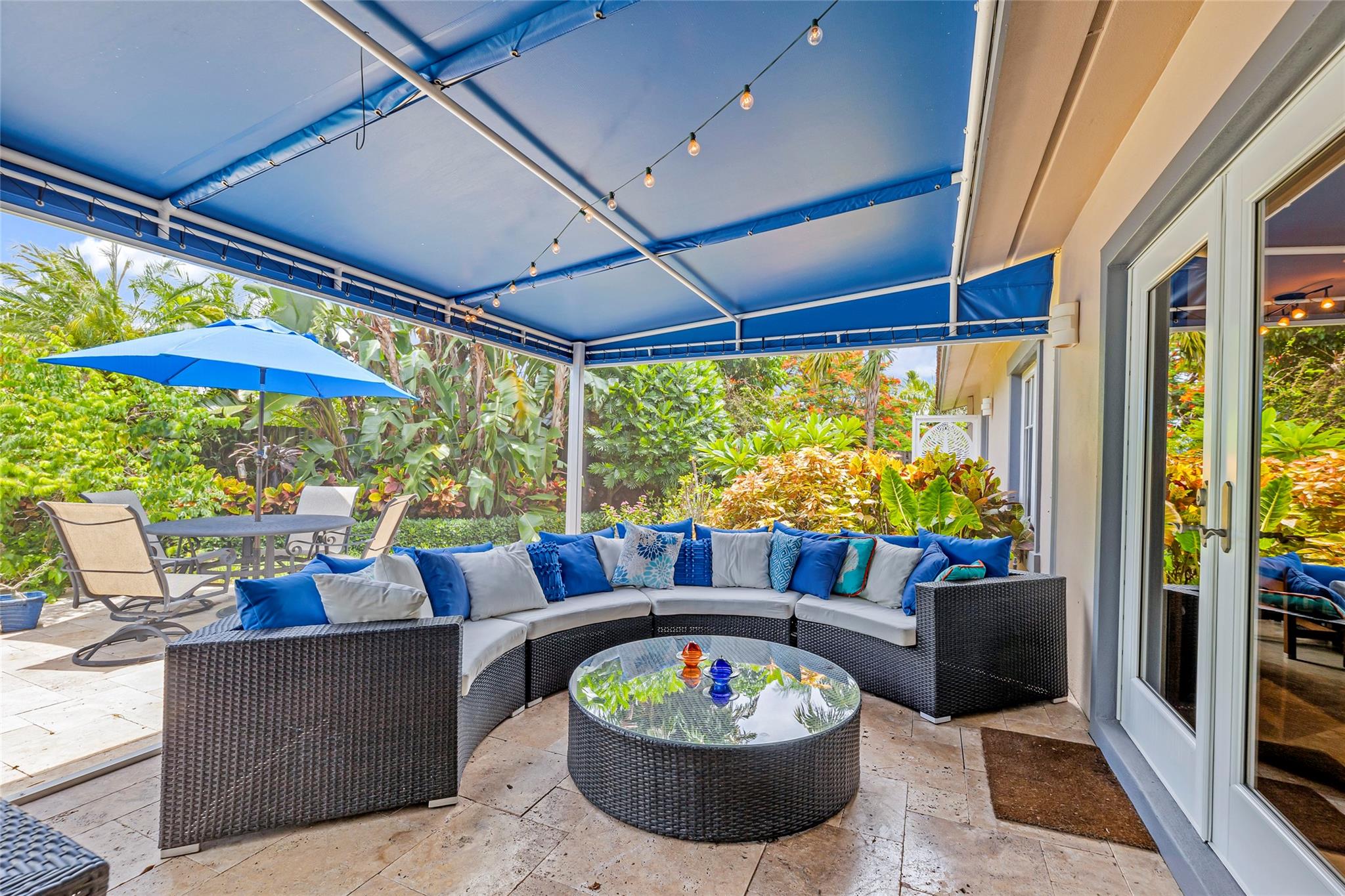 







Outdoor Living Screened-in Living Area with a view toward the backyard patio and pool
