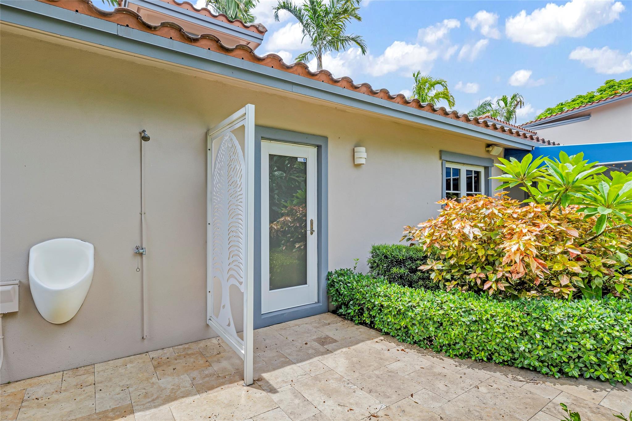 Backyard Outdoor shower and urinal near pool