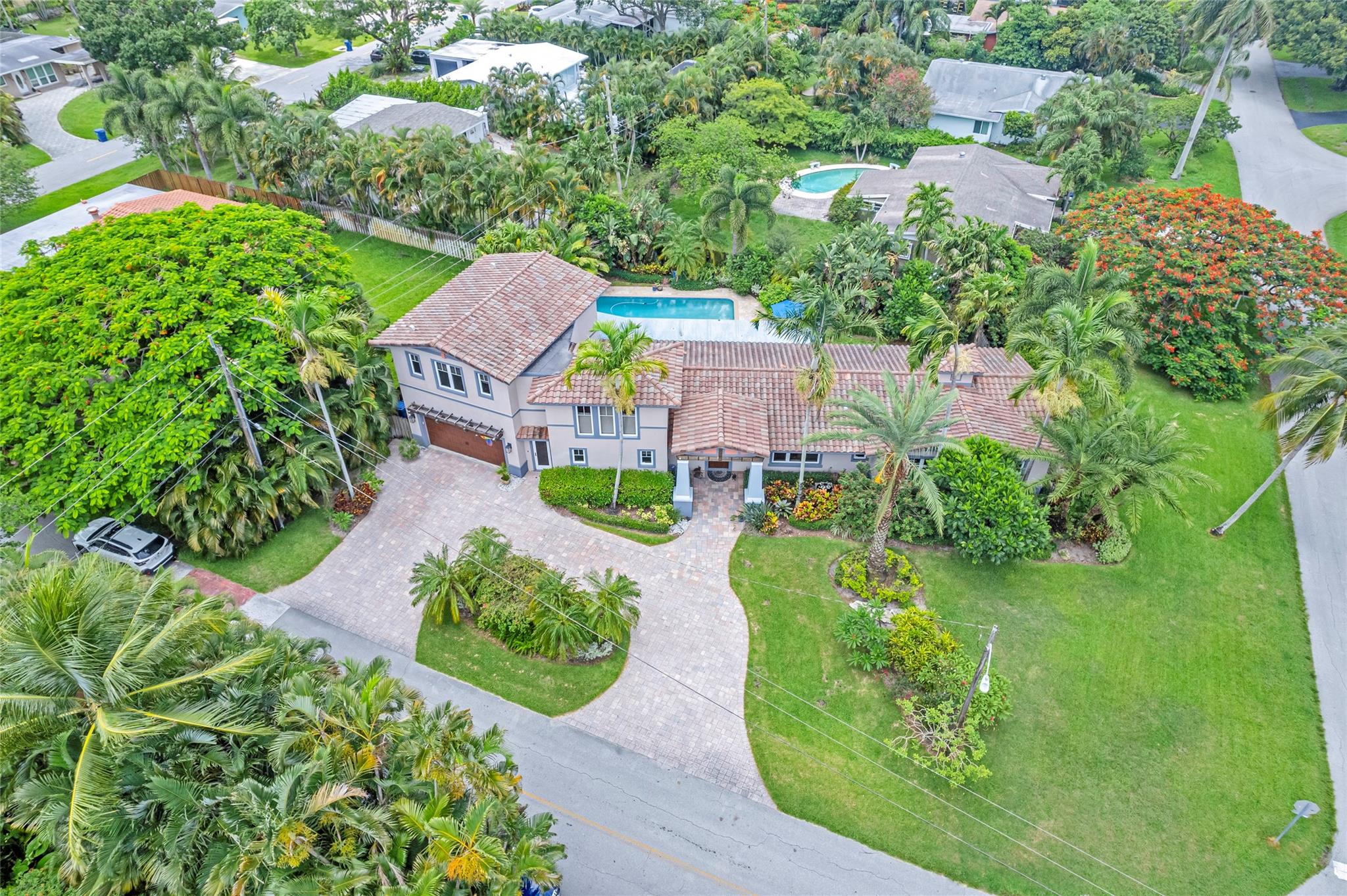 Large house and pool on oversized corner lot with circular driveway