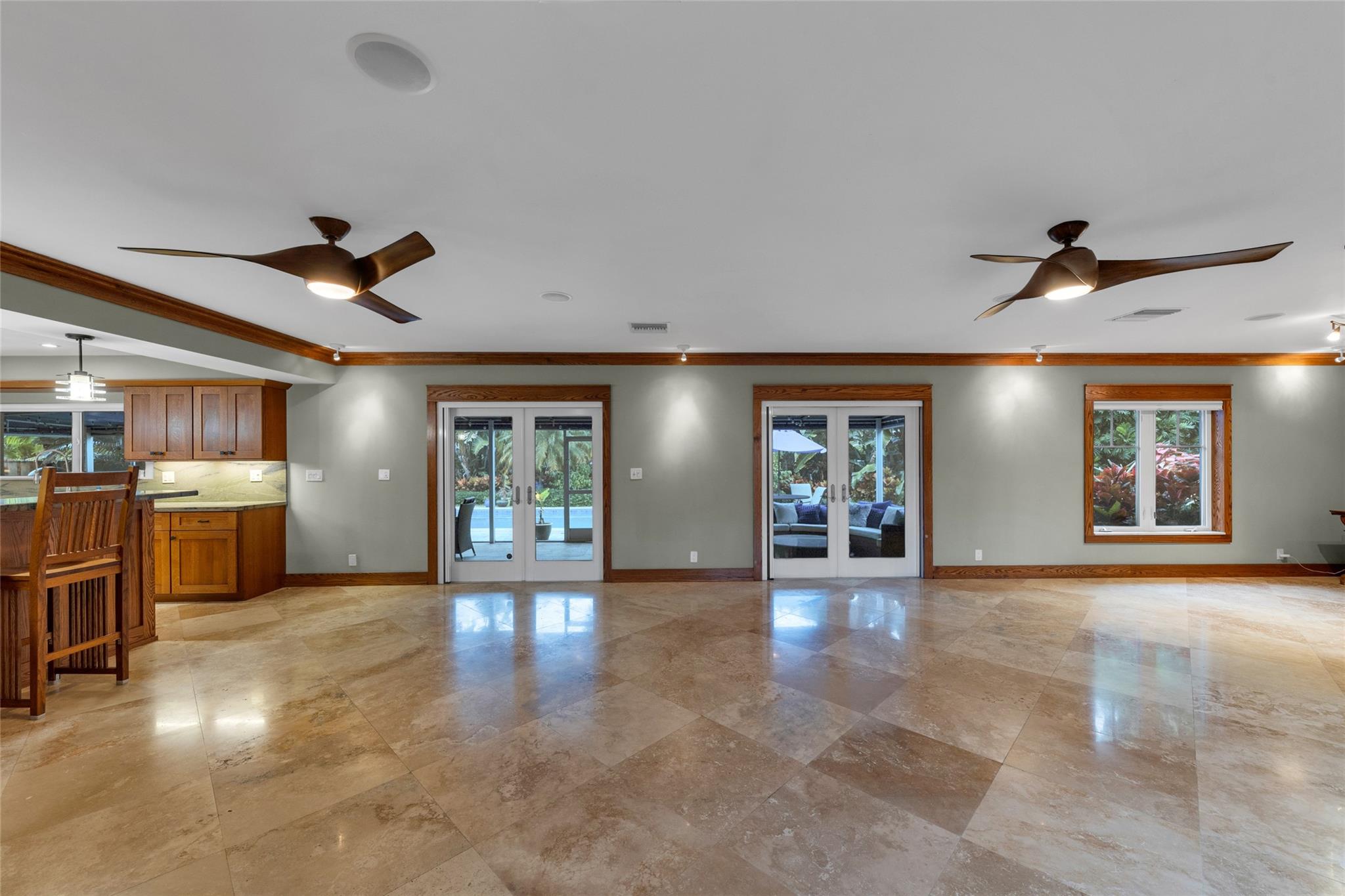 Living Room with View Toward Large Screened Patio and Pool