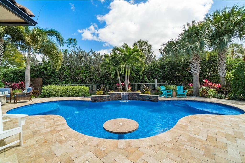 Magnificent heated private salt water LED pool oasis with cocktail/luncheon table & bench inside the pool for entertaining.