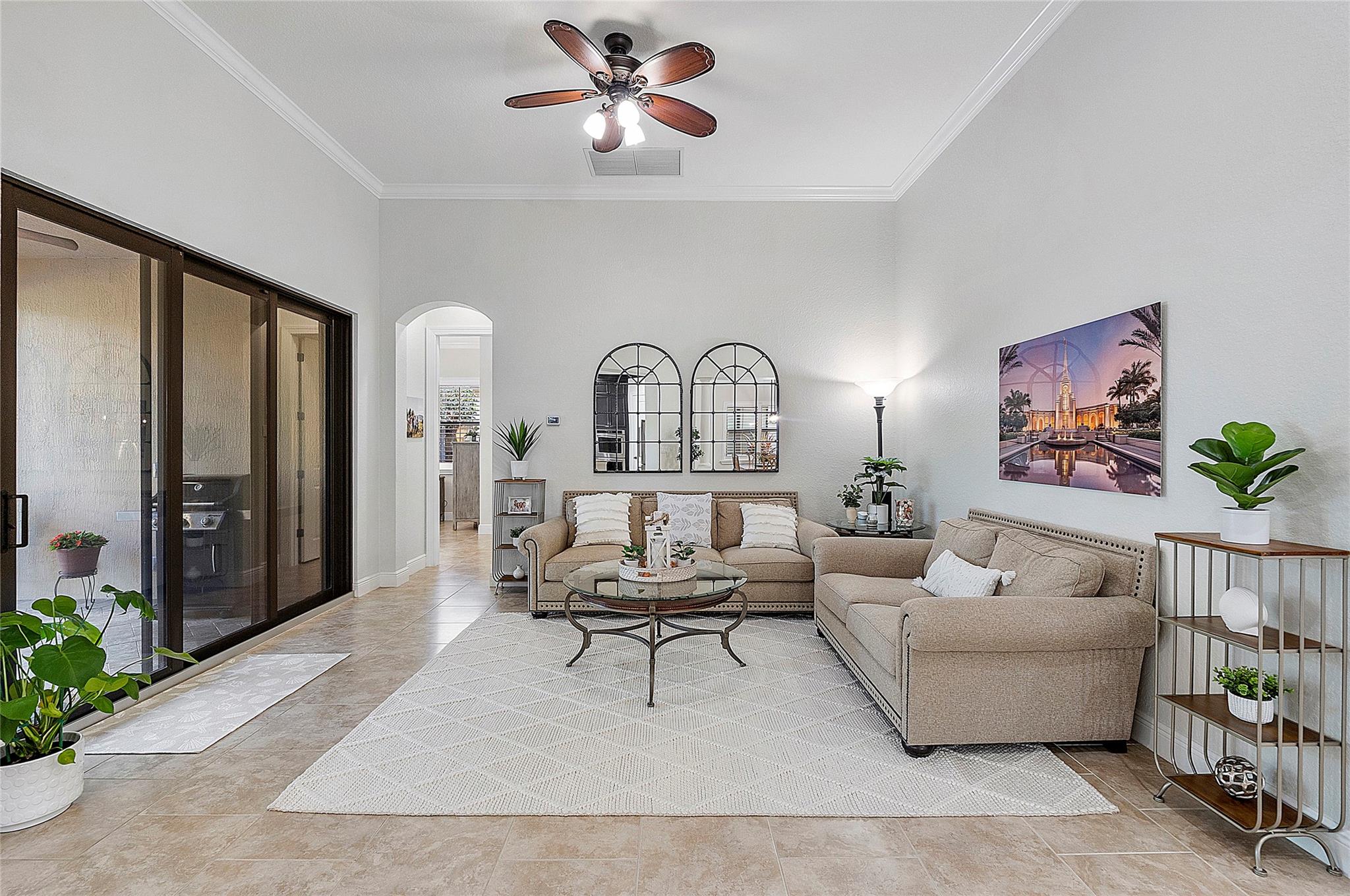Living Room overlooks the private pool/patio oasis, with separate wing leading to the master bedroom suite
