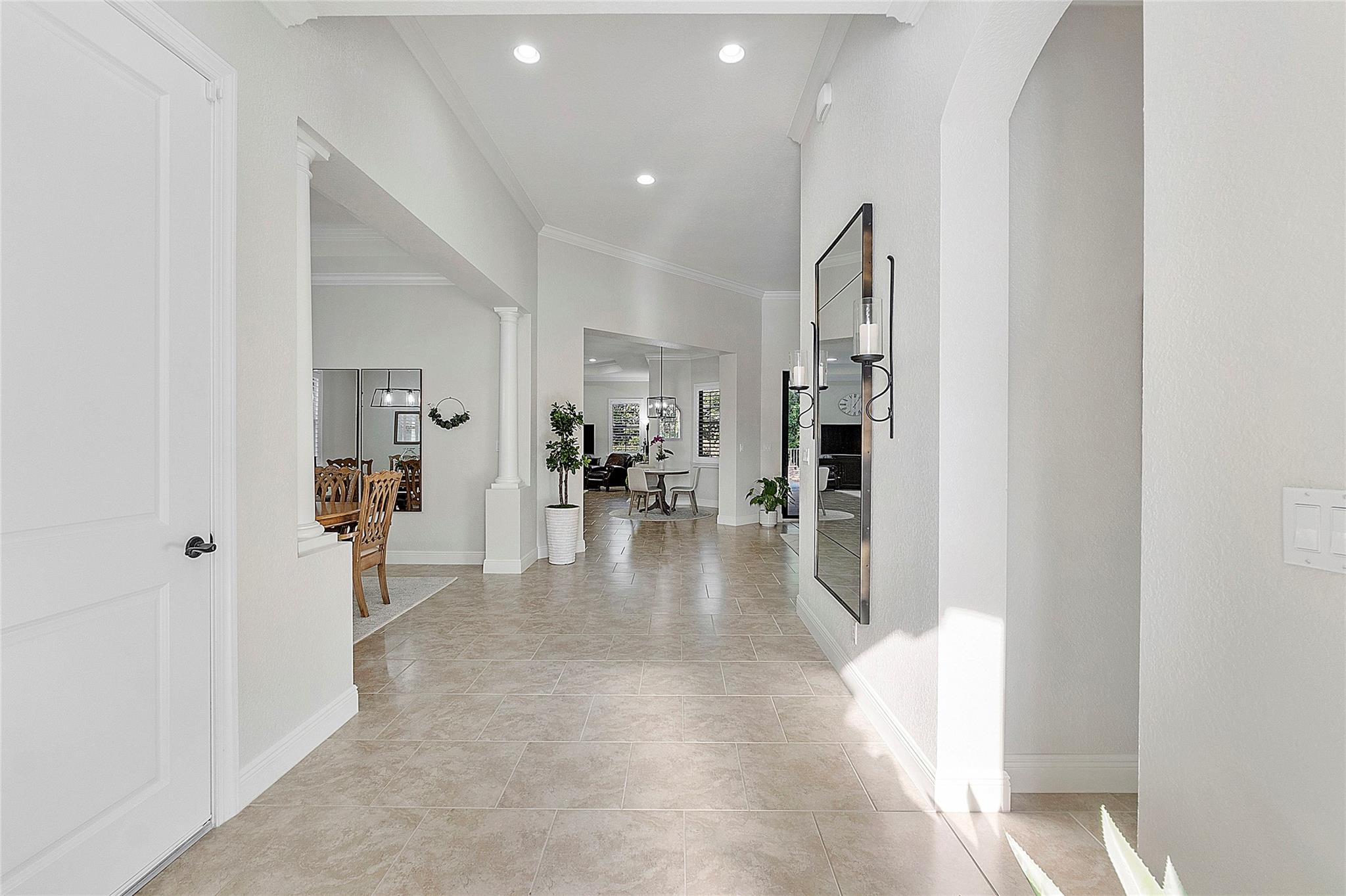 Entryway into the home with flowing Italian tile flooring