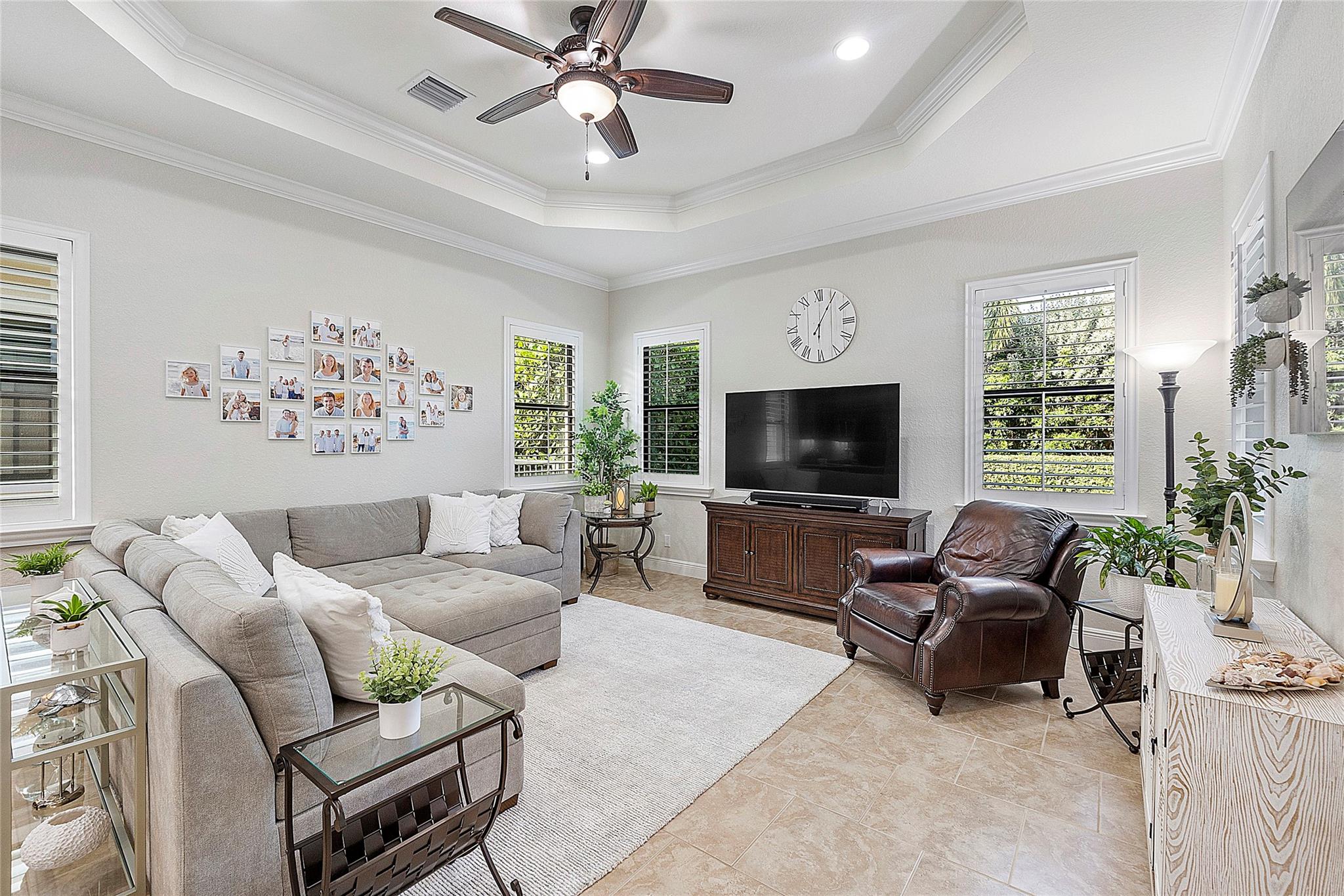 Family room with tray ceilings & crown moldings