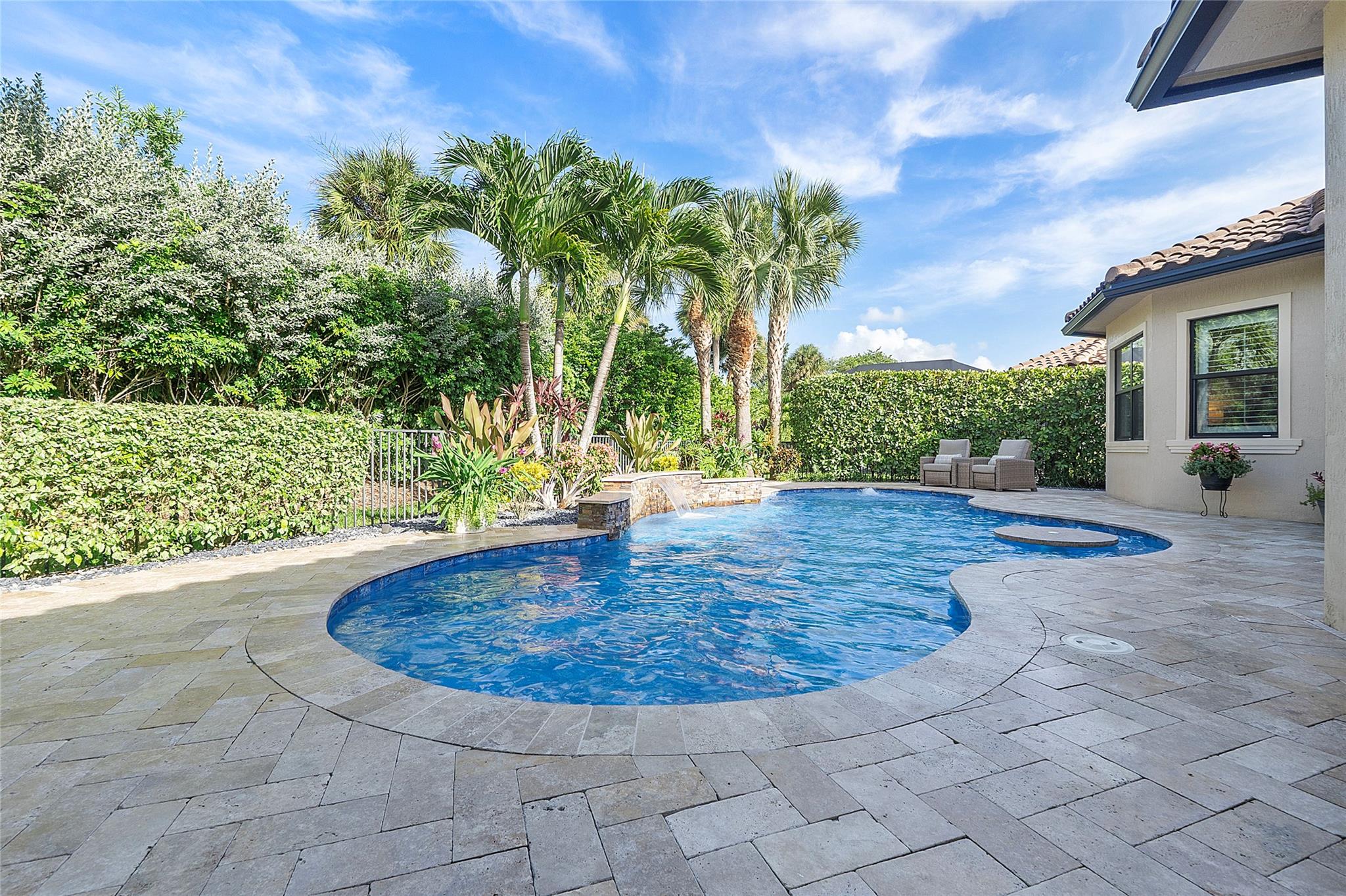 Pool deck, great for entertaining with this $120k luxurious salt water heated pool,