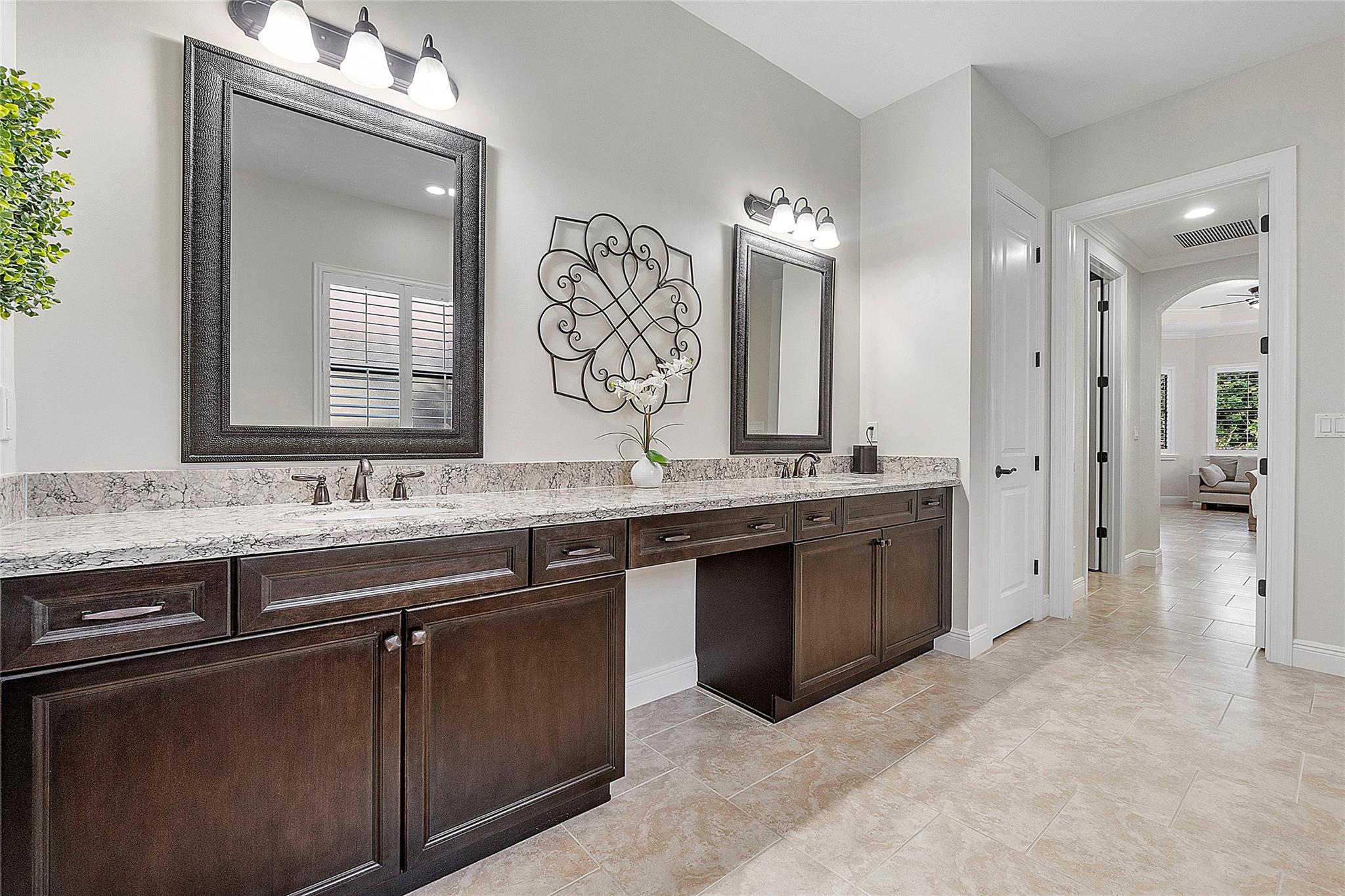 Double vanities with lots of cabinet space & linen closets